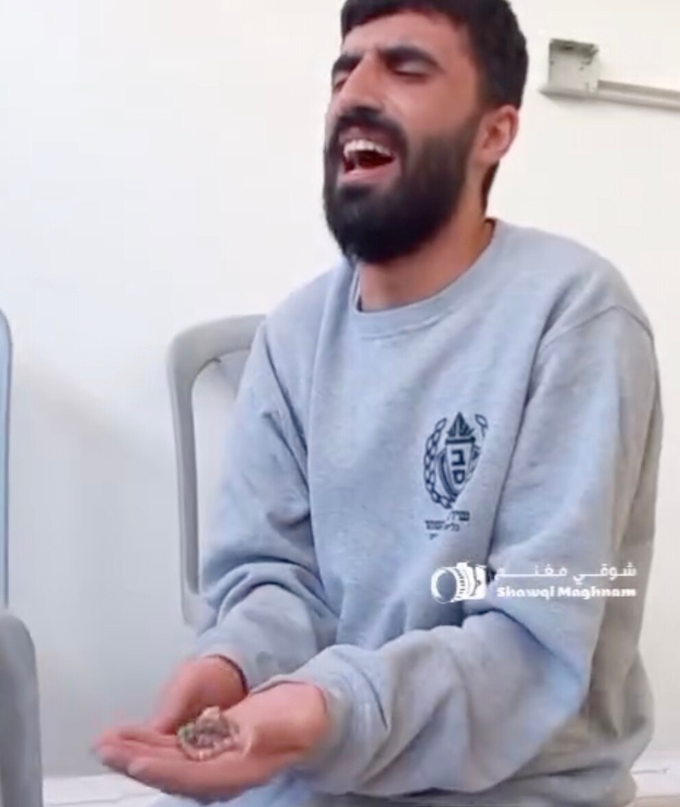 PHOTO: A released Palestinian prisoner, pictured here, October 13, 2025, in Khan Younis, Gaza, holding a bracelet for one of his daughters, only to learn she and two of his other daughters were killed during the war.