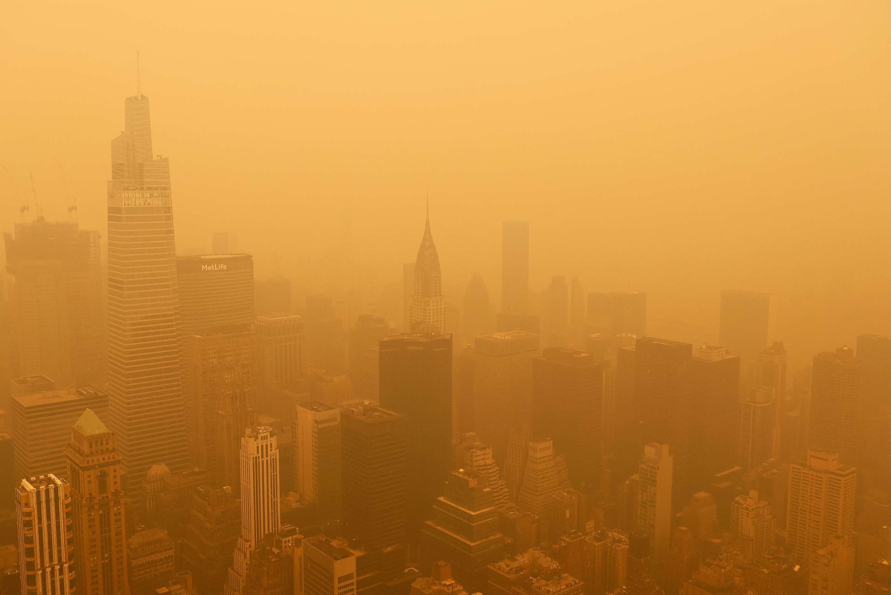 PHOTO: Heavy smoke fills the air shrouding the view to the northeast to One Vanderbilt and the Chrysler Building from the Empire State Building, June 7, 2023, in New York.