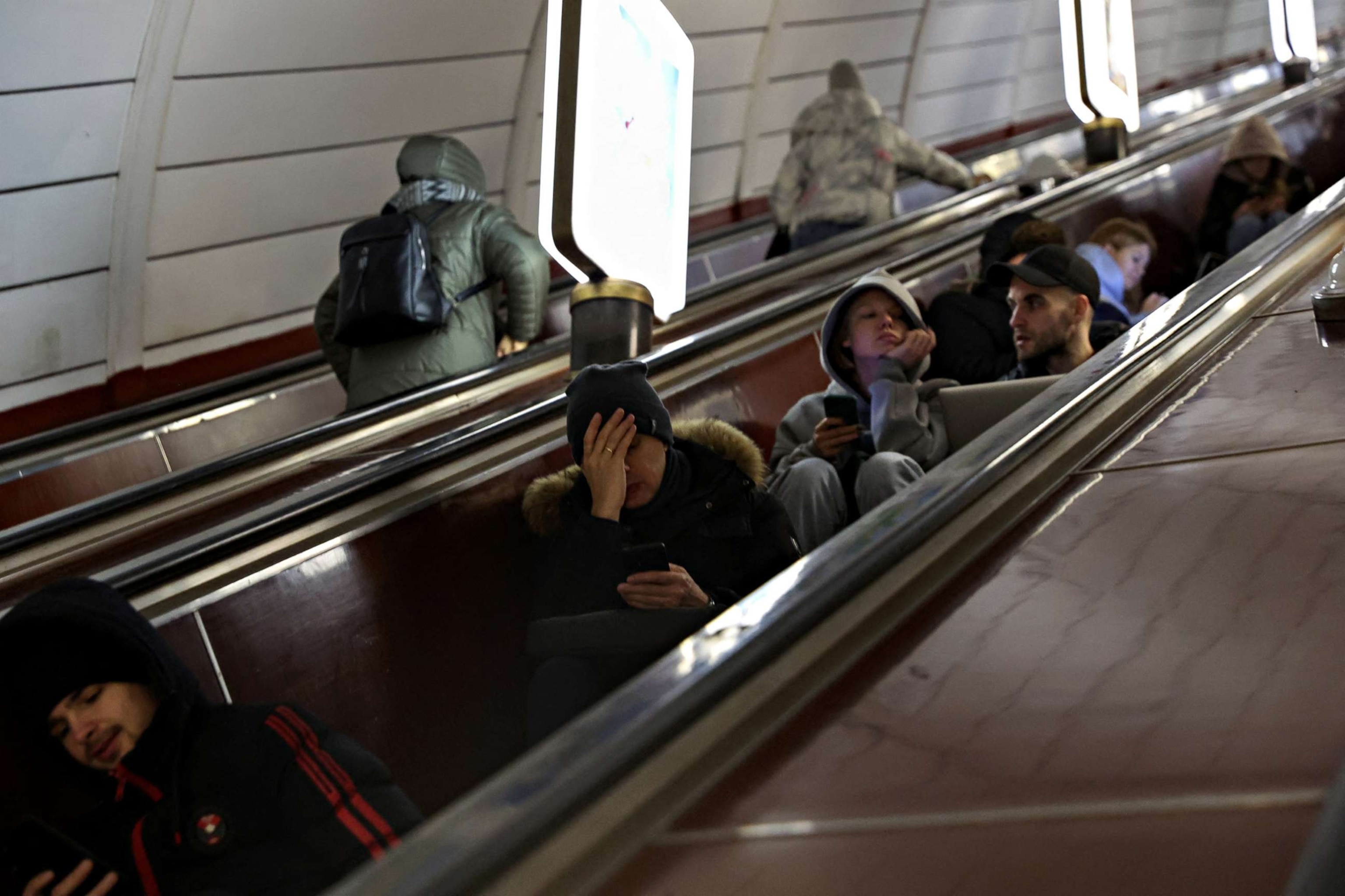 PHOTO: People take shelter inside the metro station amid Russian missile attacks in Kyiv, Ukraine, December 5, 2022. REUTERS/Shannon Stapleton