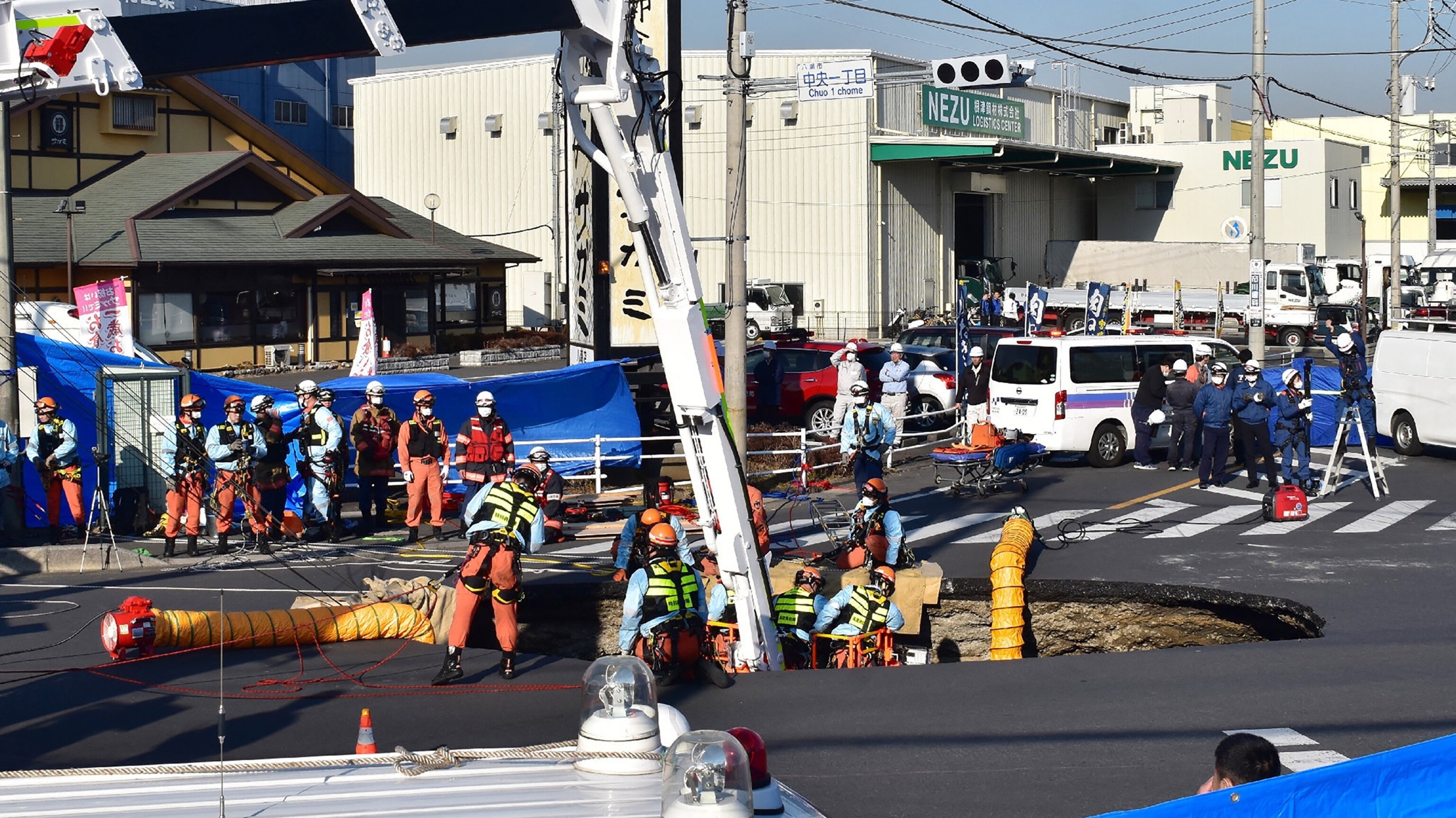 Sinkhole swallows truck in Japan, trapping driver inside - ABC News