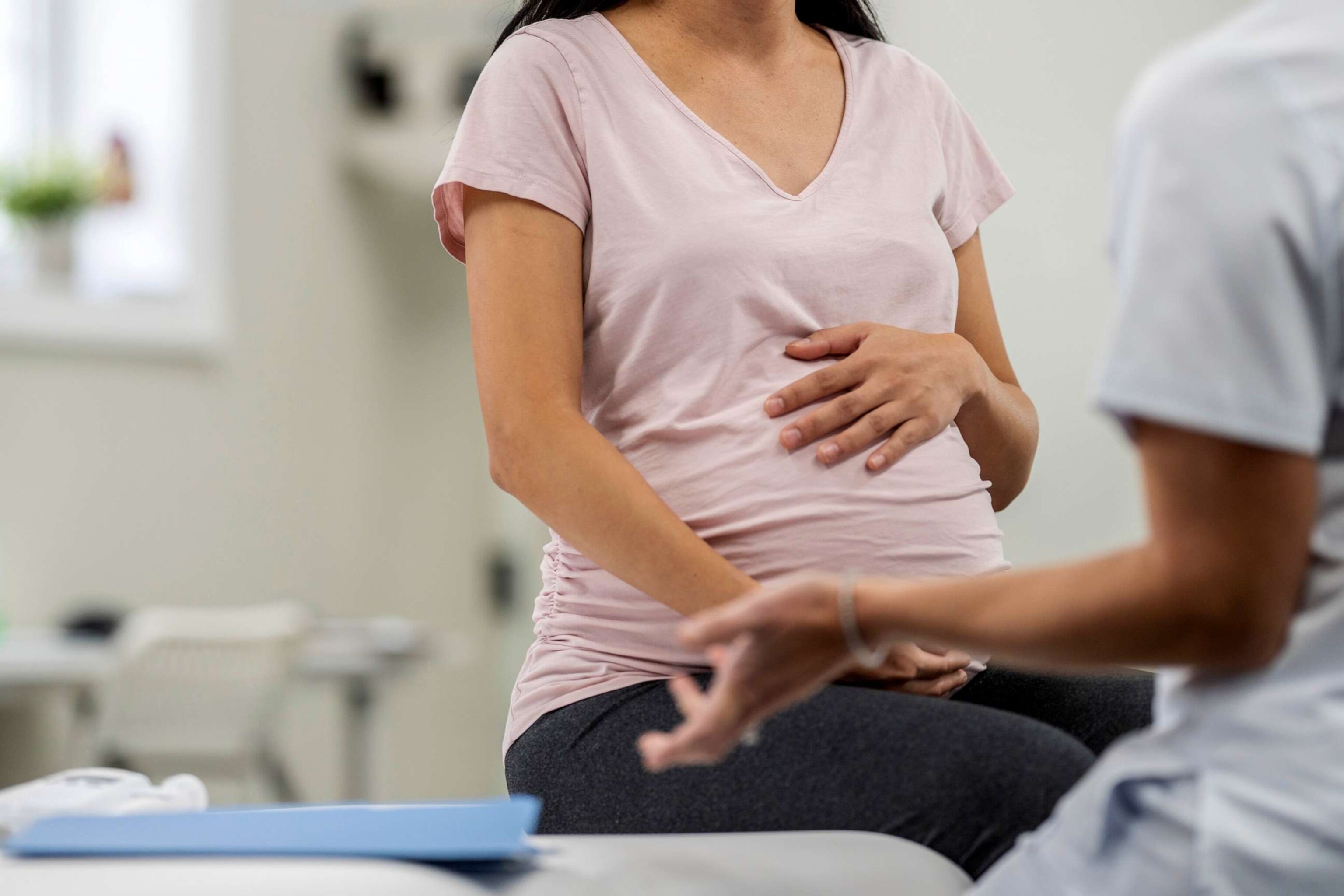 PHOTO: Stock photo of a pregnant woman speaking with her doctor.