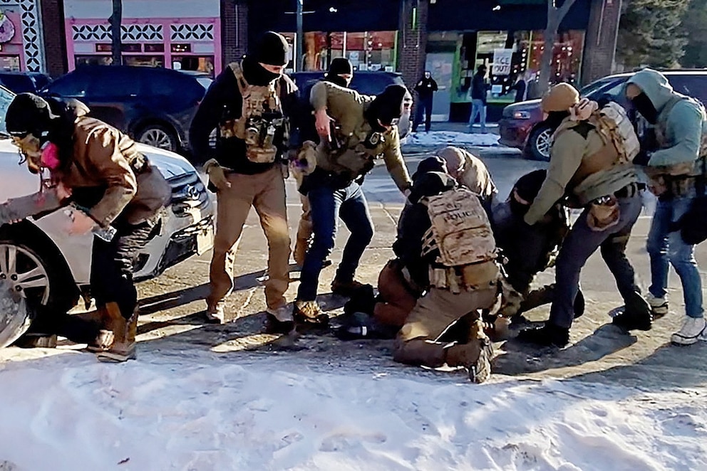 PHOTO: The moment that the firearm of Alex Pretti is retrieved from a waistband holster by a federal officer as another officer (in green) draws his weapon, before Pretti was fatally shot in Minneapolis, Minnesota, Jan. 24, 2026.