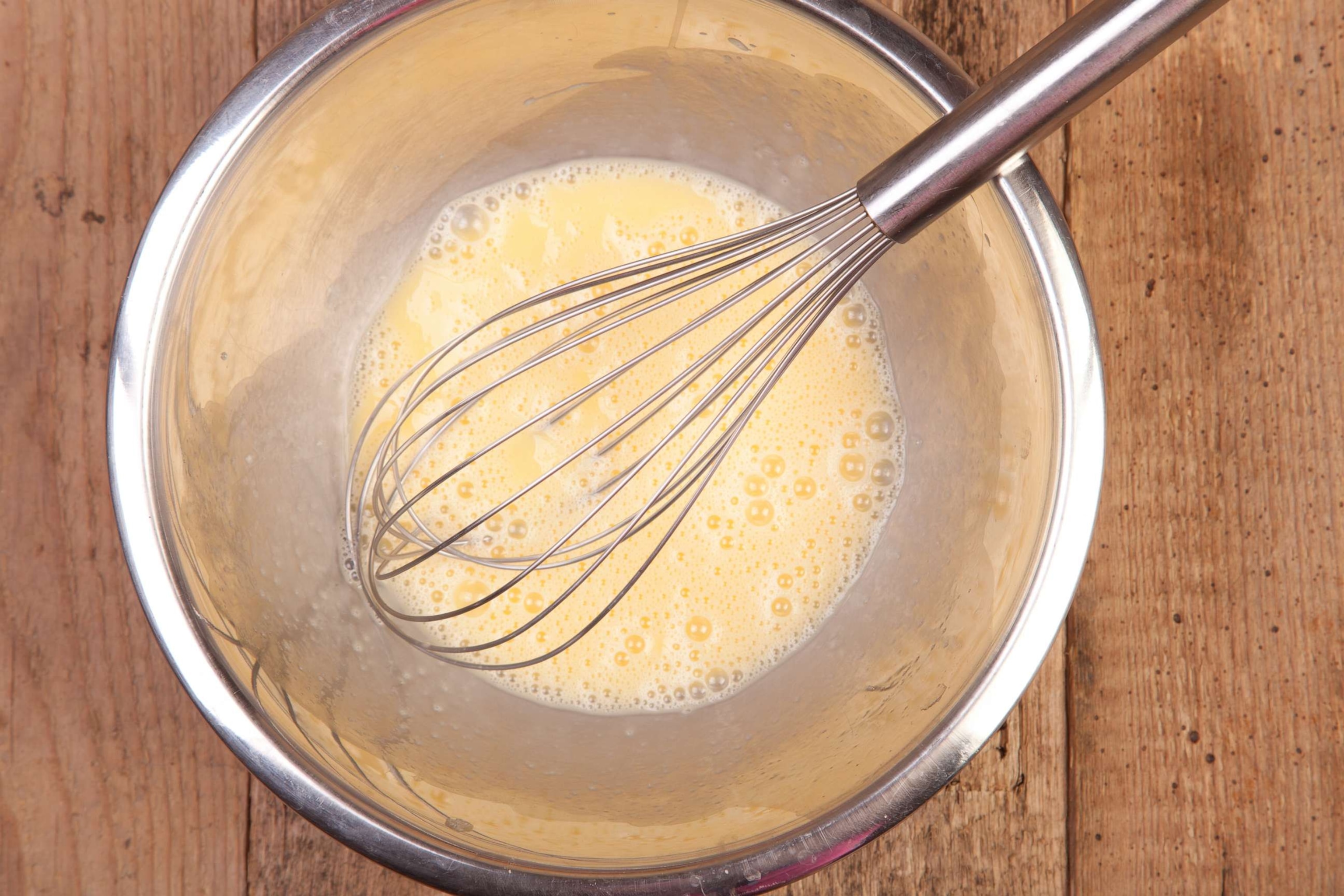 Mixing eggs and flour in bowl hi-res stock photography and images