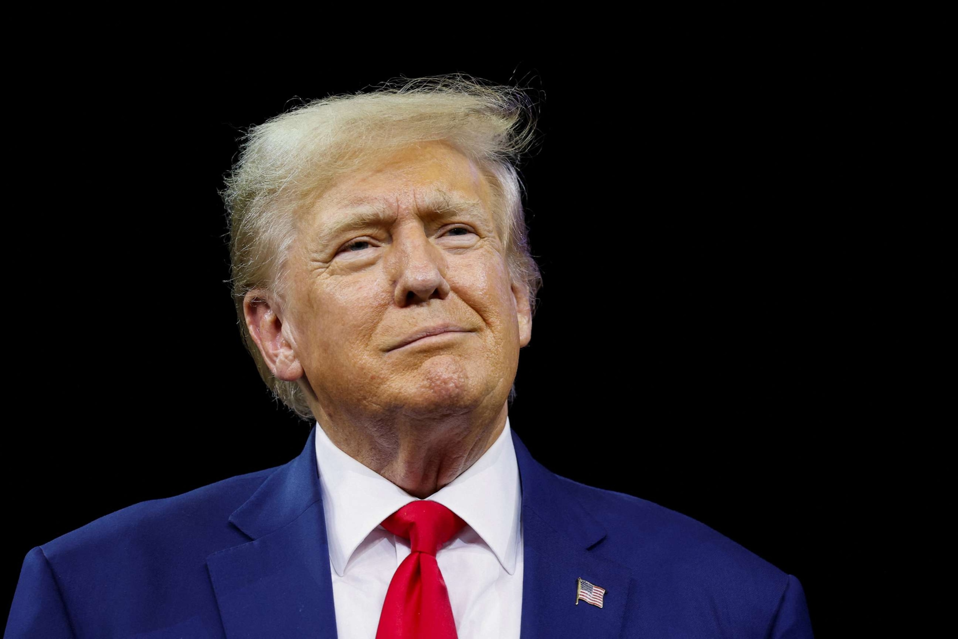 PHOTO: Former President and Republican presidential candidate Donald Trump looks on at a South Dakota Republican party rally in Rapid City, S. D., Sept. 8, 2023.