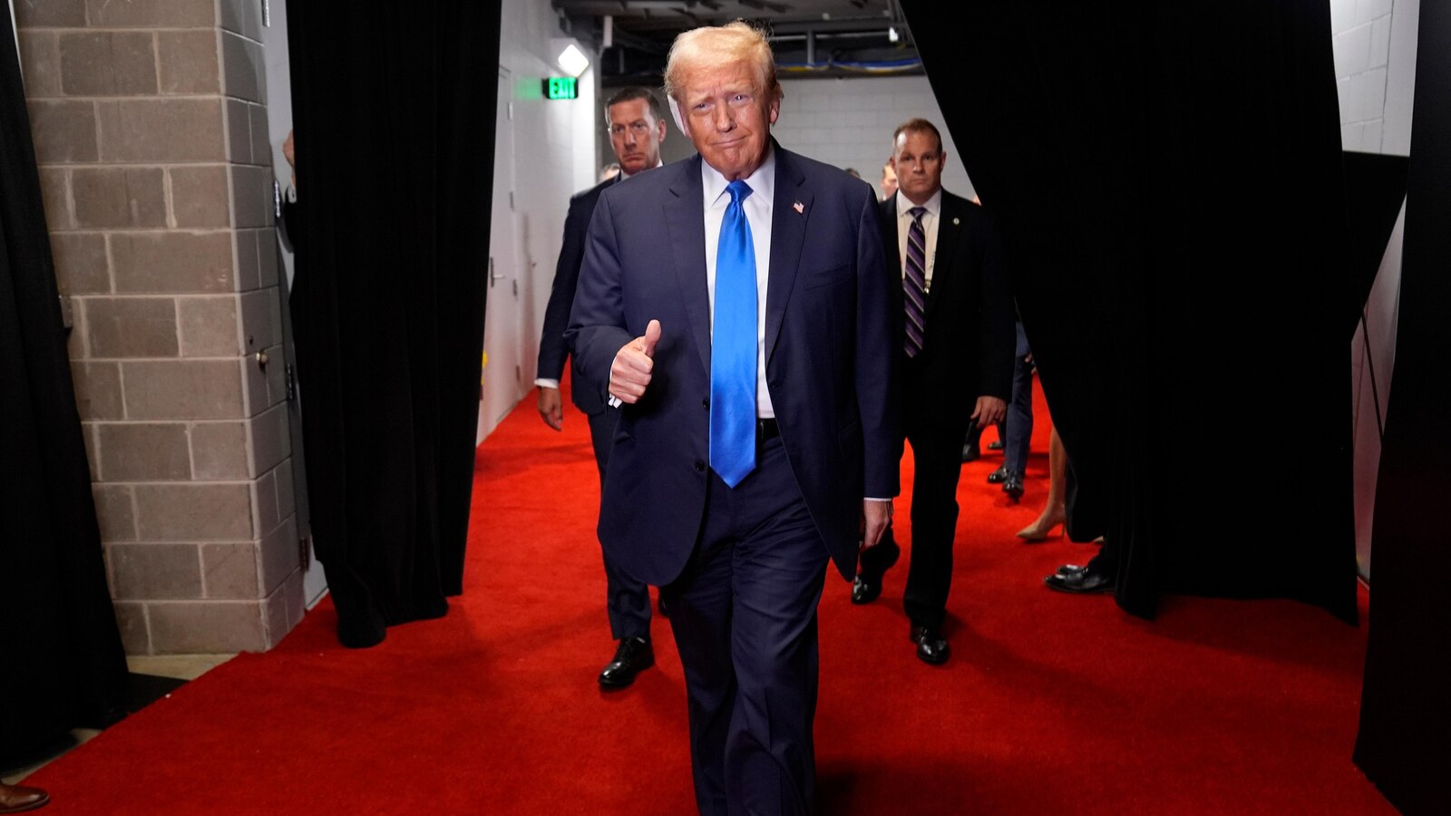  The stepped-up security around Trump is apparent, with agents walling him off from RNC crowds