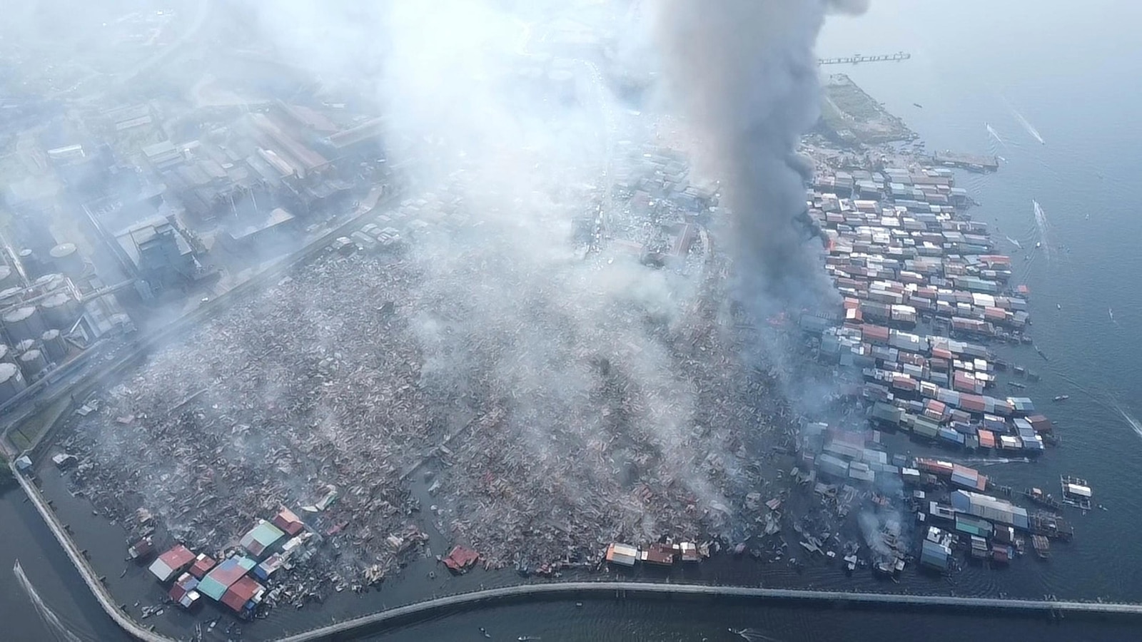 Fire destroys 1,000 homes in a Malaysian coastal village on Borneo Island