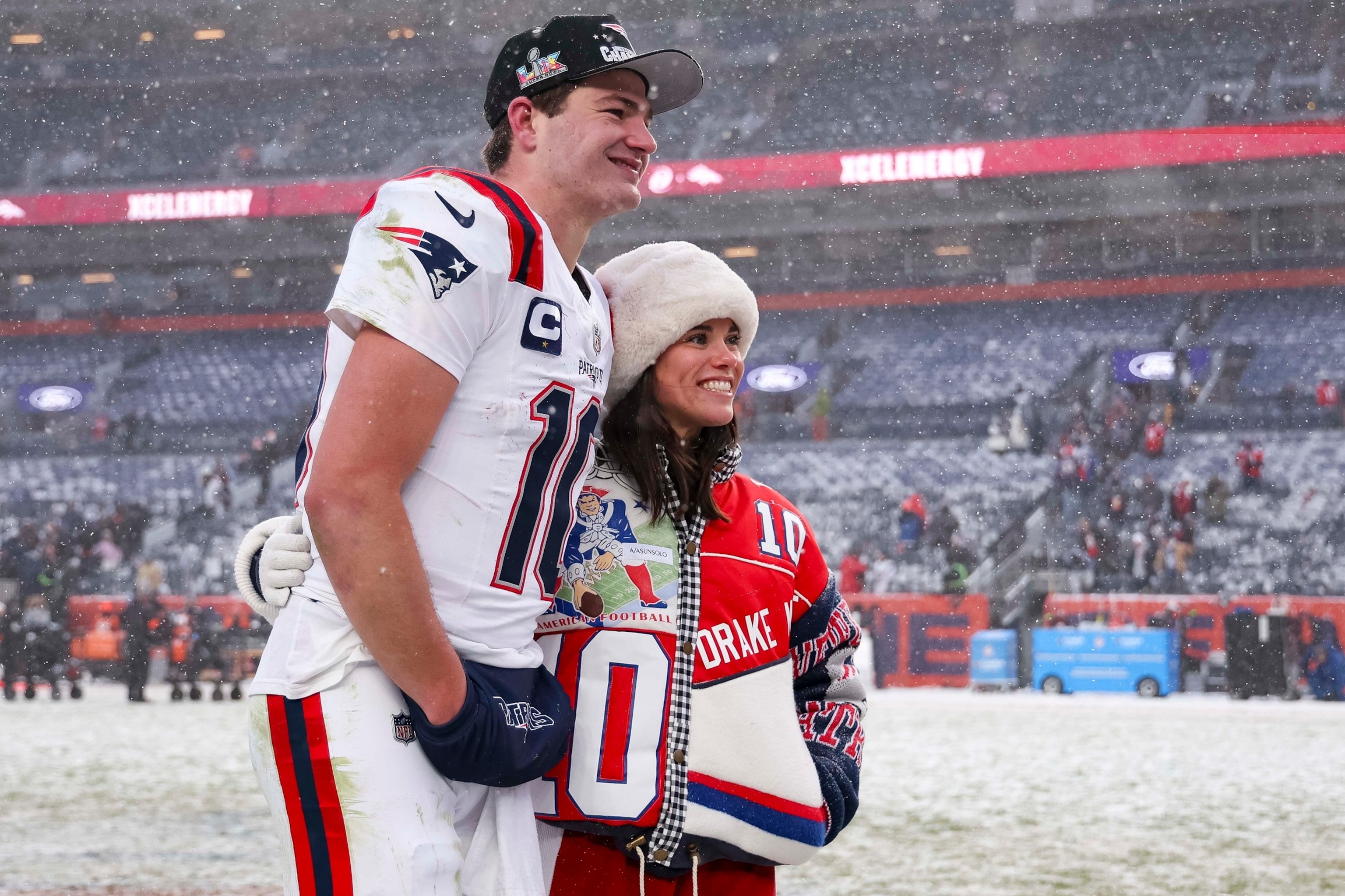 PHOTO: Drake Maye #10 of the New England Patriots and wife Ann Michael Maye pose for a photo after the AFC Championship Playoff game between the New England Patriots and the Denver Broncos at Empower Field At Mile High, Jan. 25, 2026  in Denver.