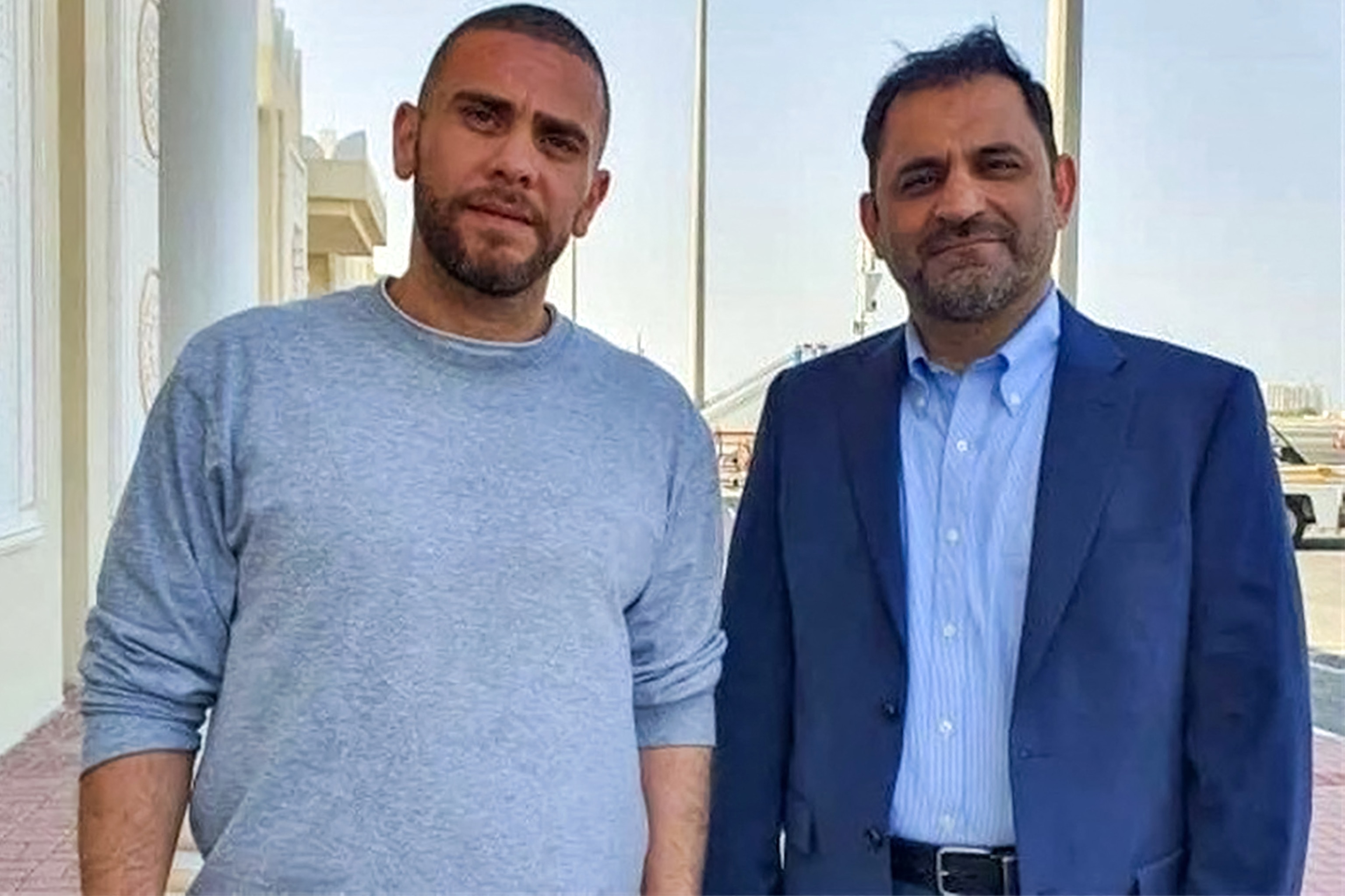 PHOTO: Mehrdad Moein Ansari, left, and Reza Sarhangpour, two Iranian nationals who were detained in the United States and released in a prisoner-swap deal with Iran, pose for a photo at Doha International Airport in Doha on Sept. 18, 2023.