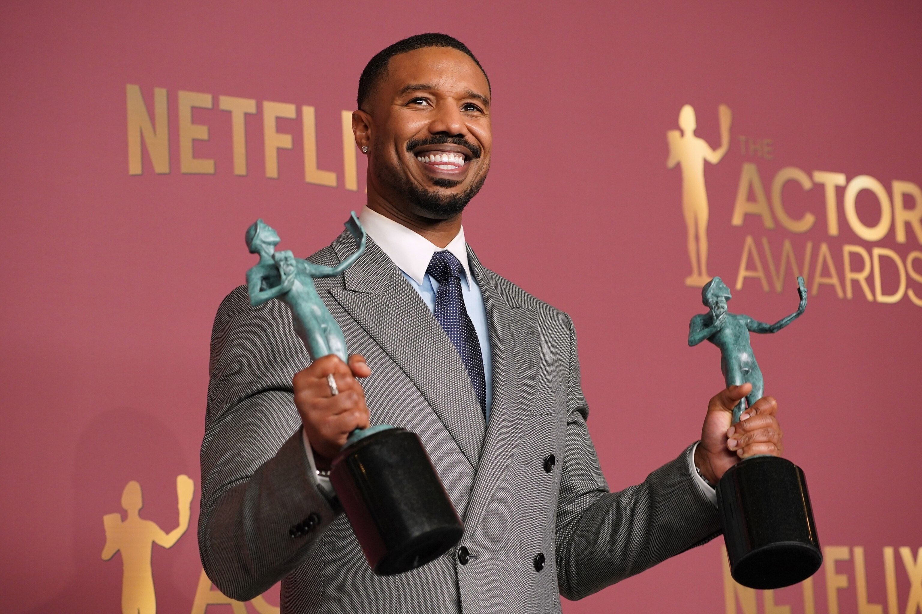 PHOTO: Michael B. Jordan poses with the awards for outstanding performance by a male actor in a leading role and outstanding performance by a cast in a motion picture for "Sinners" during the 32nd Annual Actor Awards, March 1, 2026, in Los Angeles.