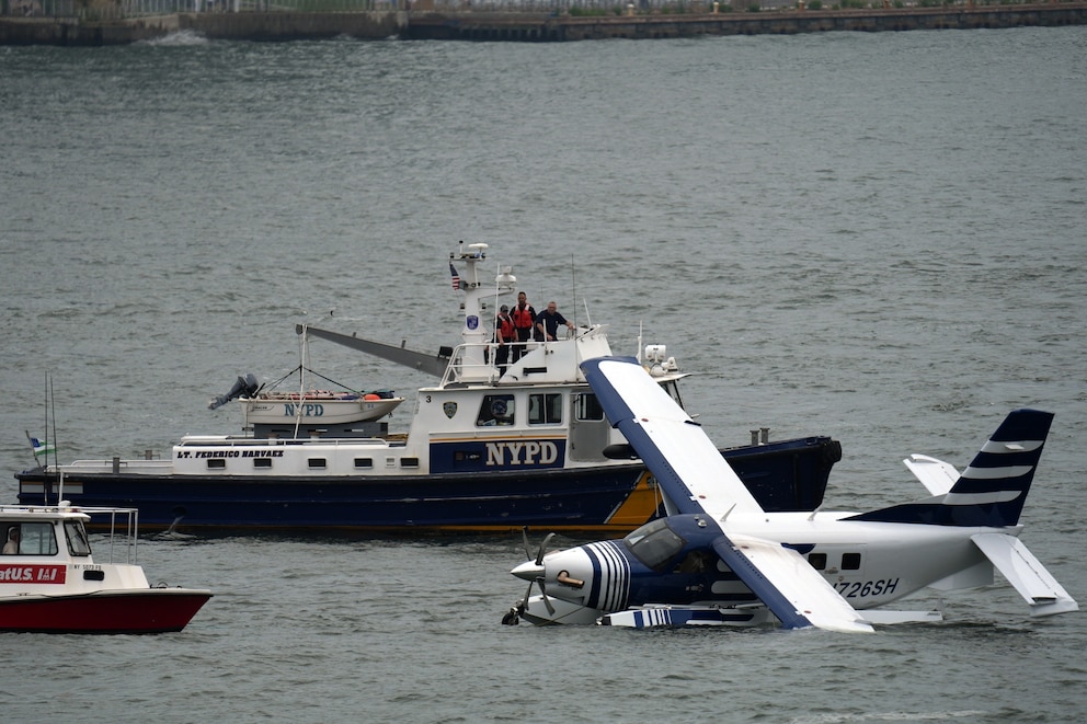 Emergency services respond to a crashed seaplane in the East River on July 5, 2026, in New York City.