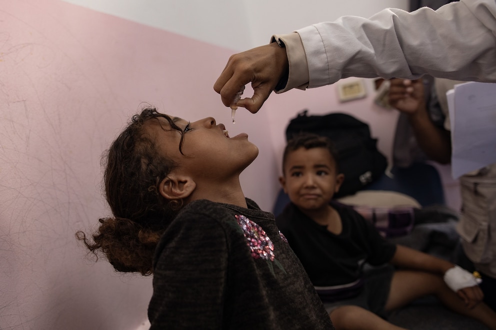 PHOTO: A nurse administers polio vaccine drops to a Palestinian child at Nasser hospital in Khan Yunis, southern Gaza Strip, Aug. 31 2024.