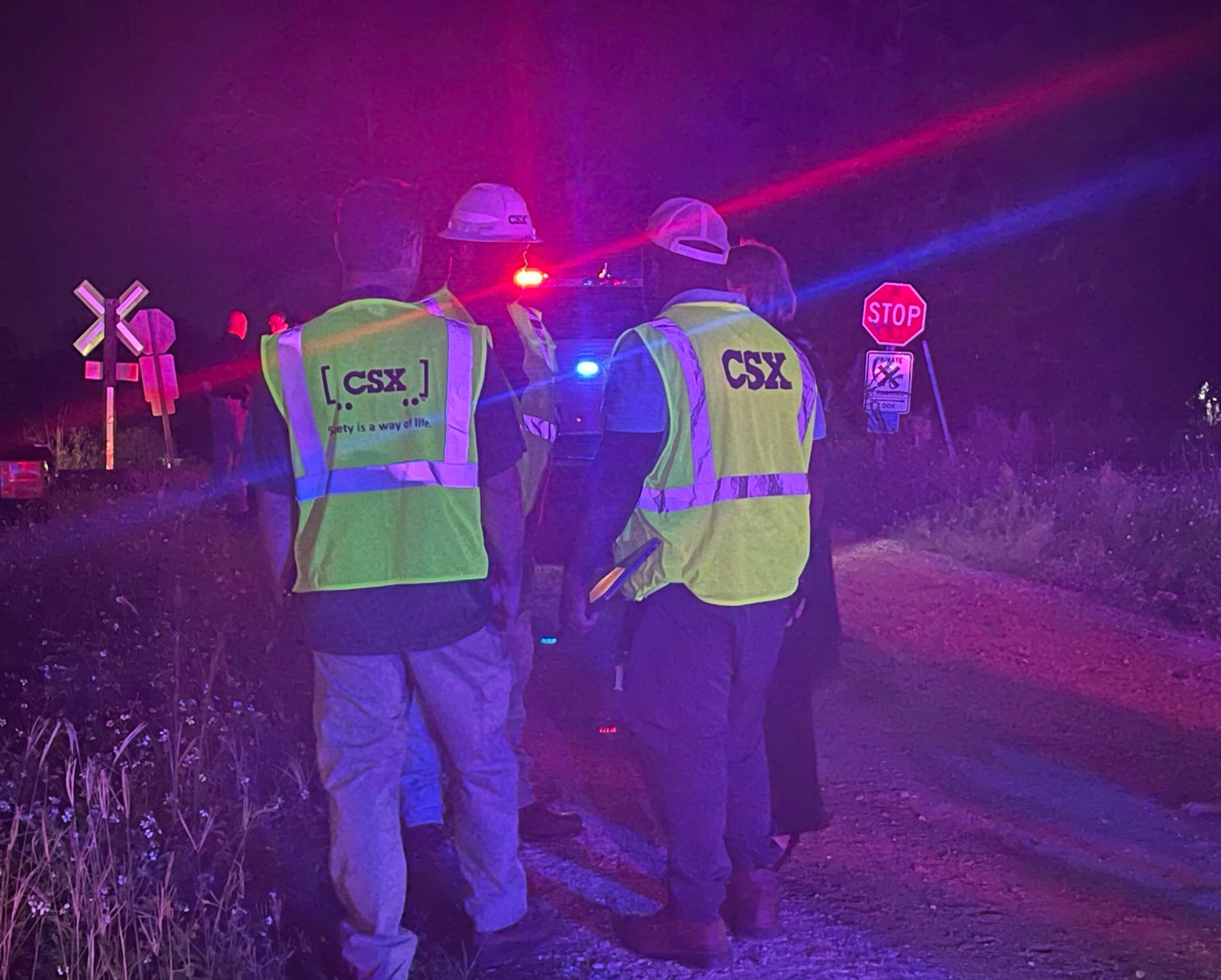 PHOTO: Workers gather near the site where a train crashed into an SUV in Hillsborough County, Florida, on Saturday, Sept. 23, 2023.