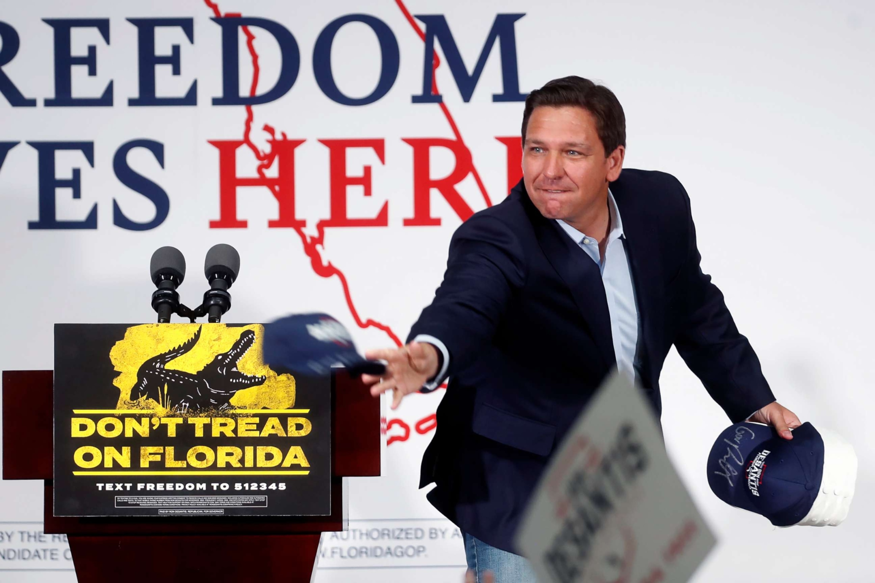 PHOTO: Republican incumbent Florida Gov. Ron DeSantis tosses hats into the crowd before giving a campaign speech, Nov. 6, 2022, in Sun City Center, Fla. 