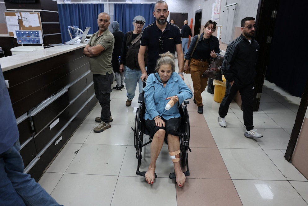 PHOTO: Heidi Levine, a photojournalist with the Washington Post, leaves a hospital after sustaining multiple injuries during an attack by Israeli militant settlers on Palestinians harvesting olives, in Ramallah, West Bank, October 16, 2026.