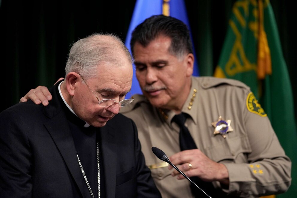PHOTO: Los Angeles County Sheriff Robert Luna, right, hugs Archbishop of Los Angeles, Jose H. Gomez during a news conference, Feb. 20, 2023, announcing an arrest has been made in connection to the murder of bishop David O'Connell, in Los Angeles.
