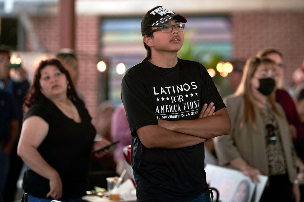 PHOTO: In this Oct. 10, 2022, file photo, a man with a Latinos for America t-shirt attends an event at the University Drafthouse in McAllen, Texas.