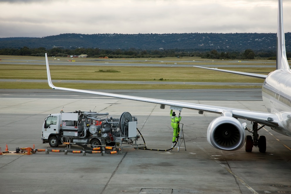 PHOTO: An airplane being refueled on the tarmac.