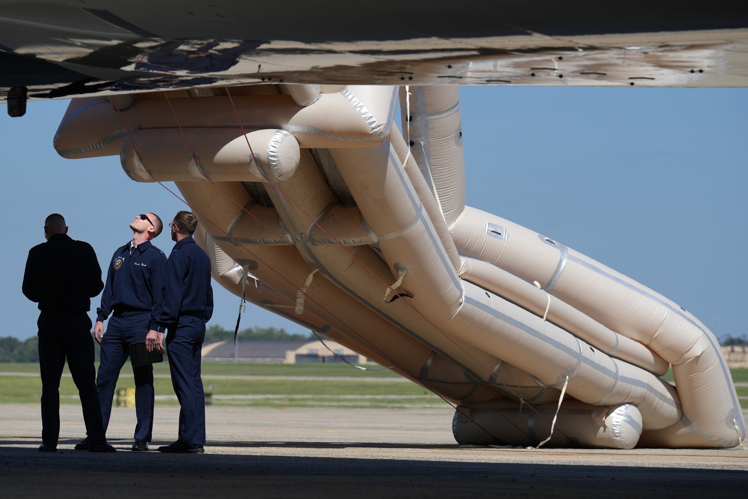 PHOTO: U.S. Air Force personnel look after an emergency inflatable slide deployed on Air Force One before before Donald Trump arrived to board at Joint Base Andrews, Md., Sept. 9, 2026.