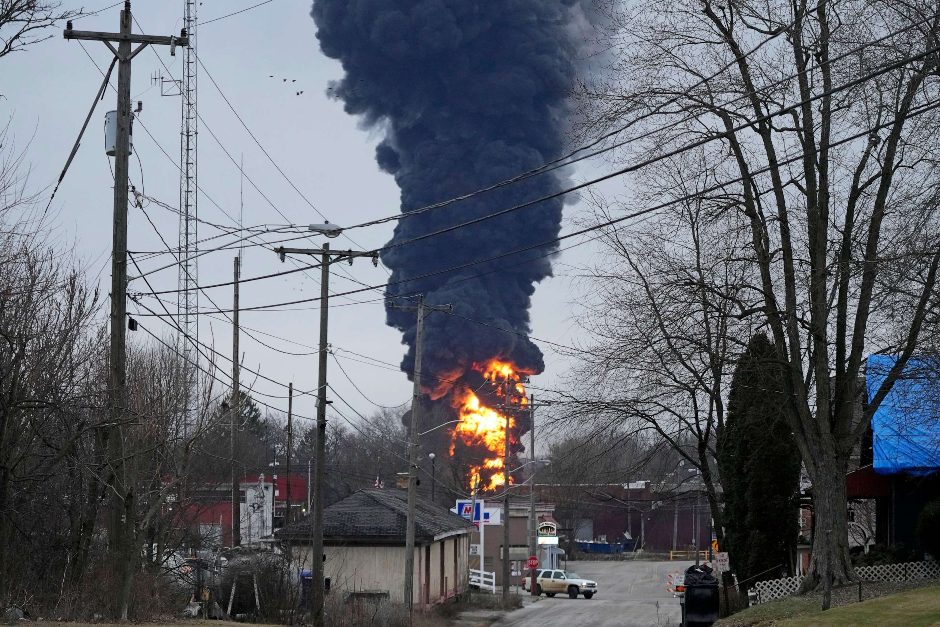 PHOTO: Flames and black smoke billow over East Palestine, Ohio, as a result of a controlled detonation of a portion of the derailed Norfolk Southern Railway trail on Feb. 6, 2023.