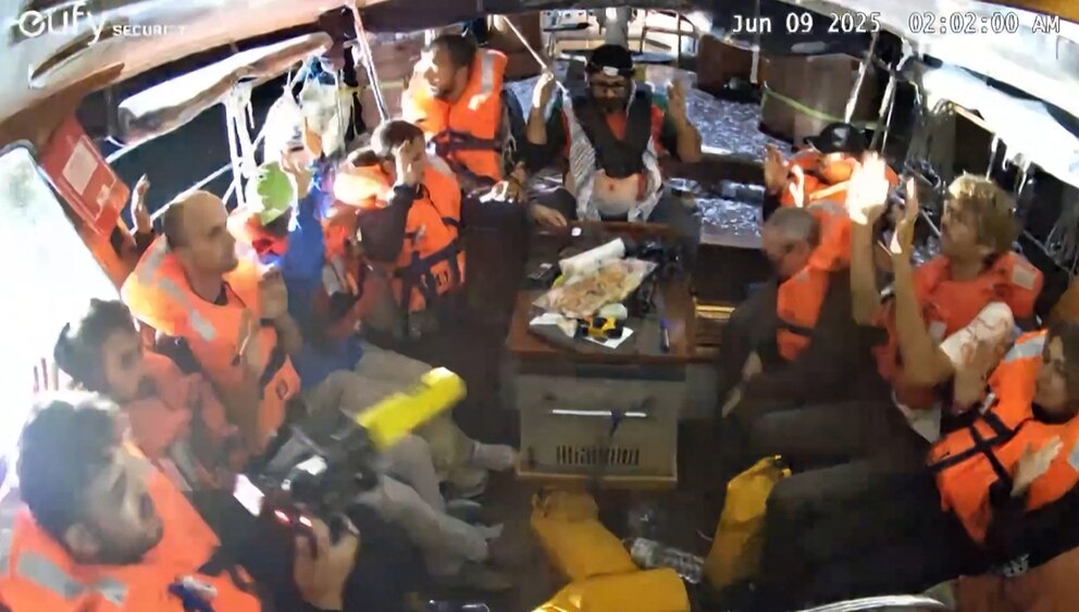 PHOTO: An image grab from footage released by Freedom Flotilla Coalition on June 9, 2025, shows activists on board the Gaza-bound aid boat Madleen.