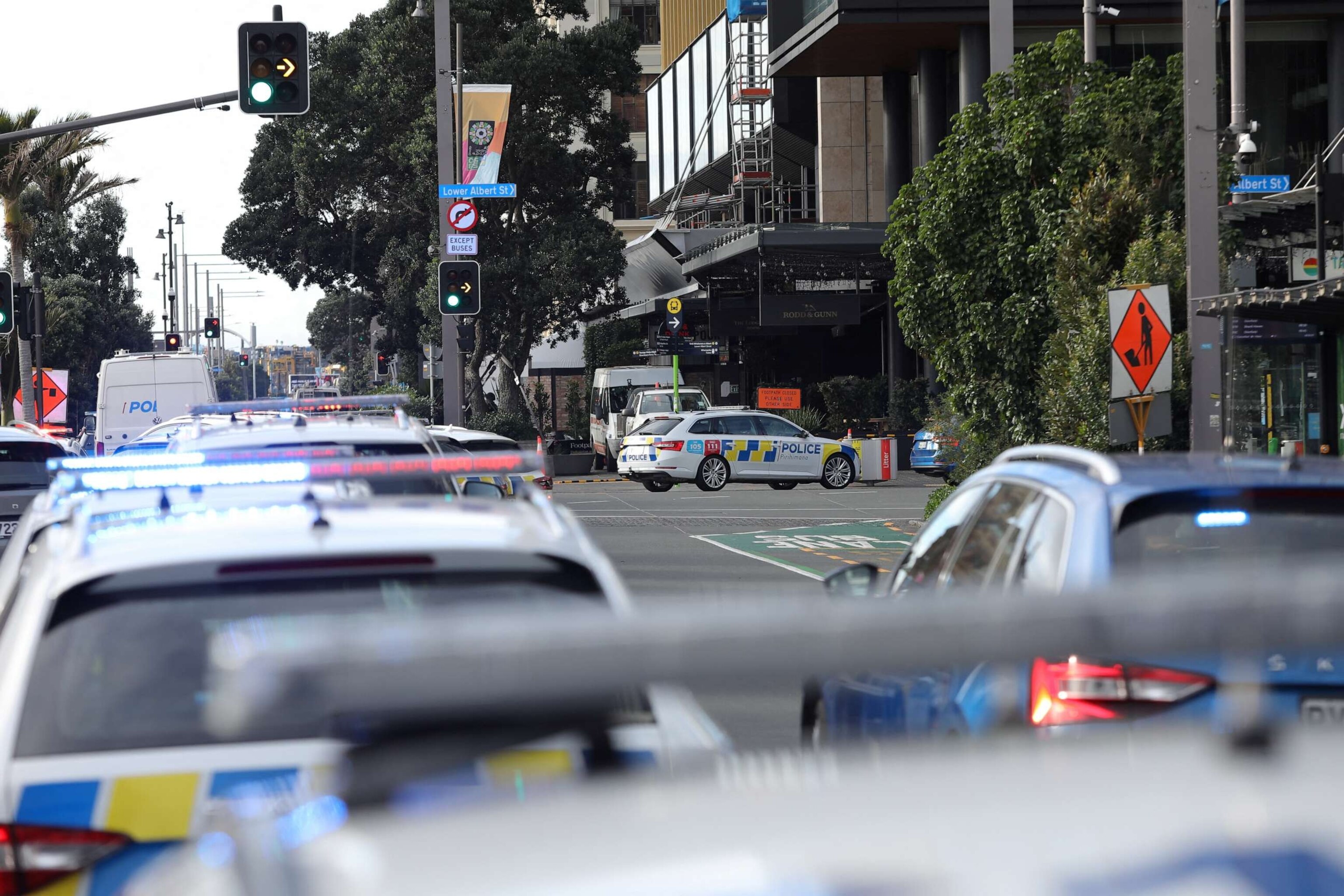 PHOTO: Police vehicles are seen near the location of a reported shooting in Auckland, New Zealand, July 20, 2023.