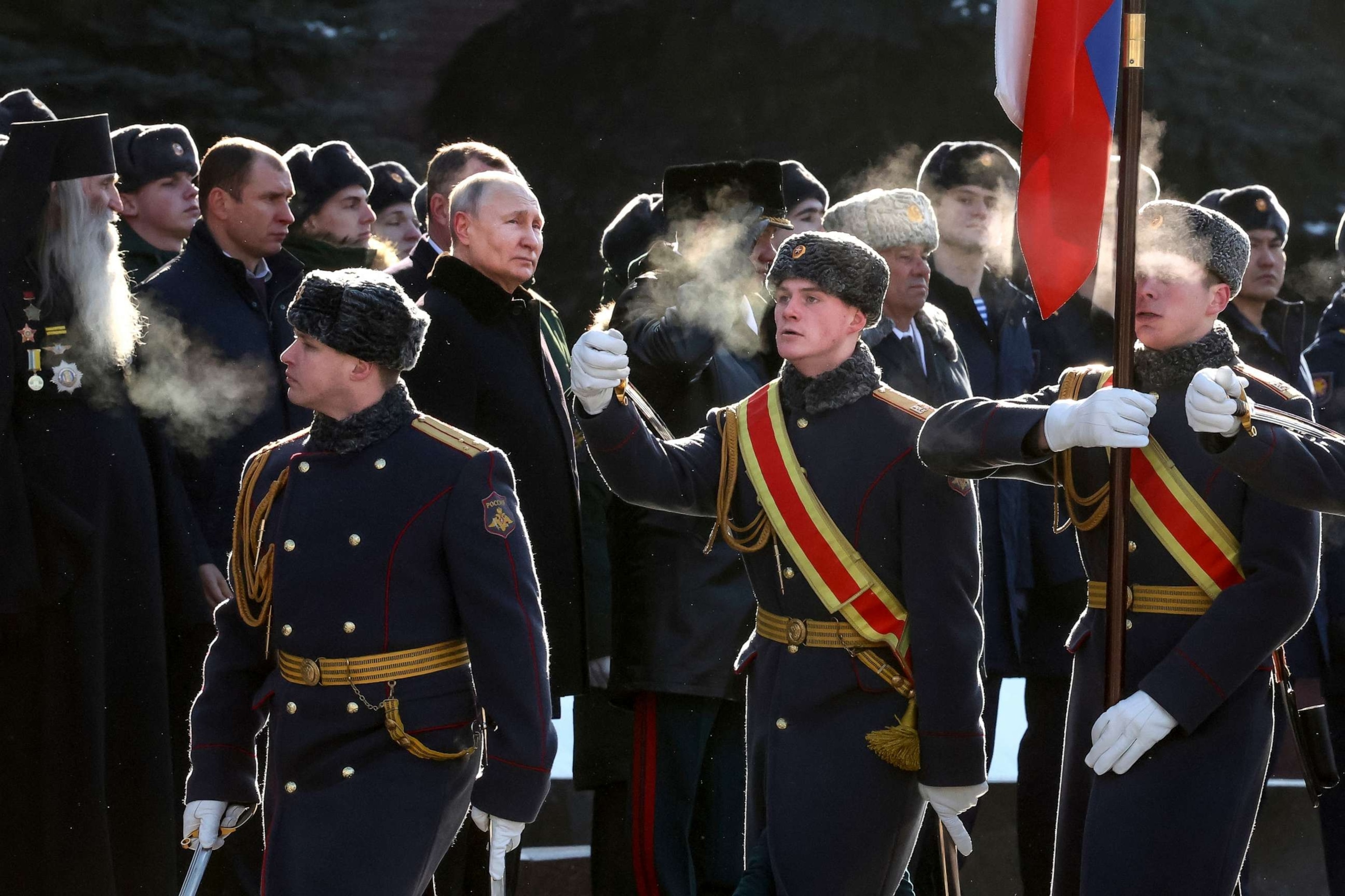 PHOTO: Russian President Vladimir Putin, center left, attends a wreath-laying ceremony at the Tomb of the Unknown Soldier, near the Kremlin Wall during the national celebrations of the "Defender of the Fatherland Day" in Moscow, Russia, on Feb. 23, 2023.