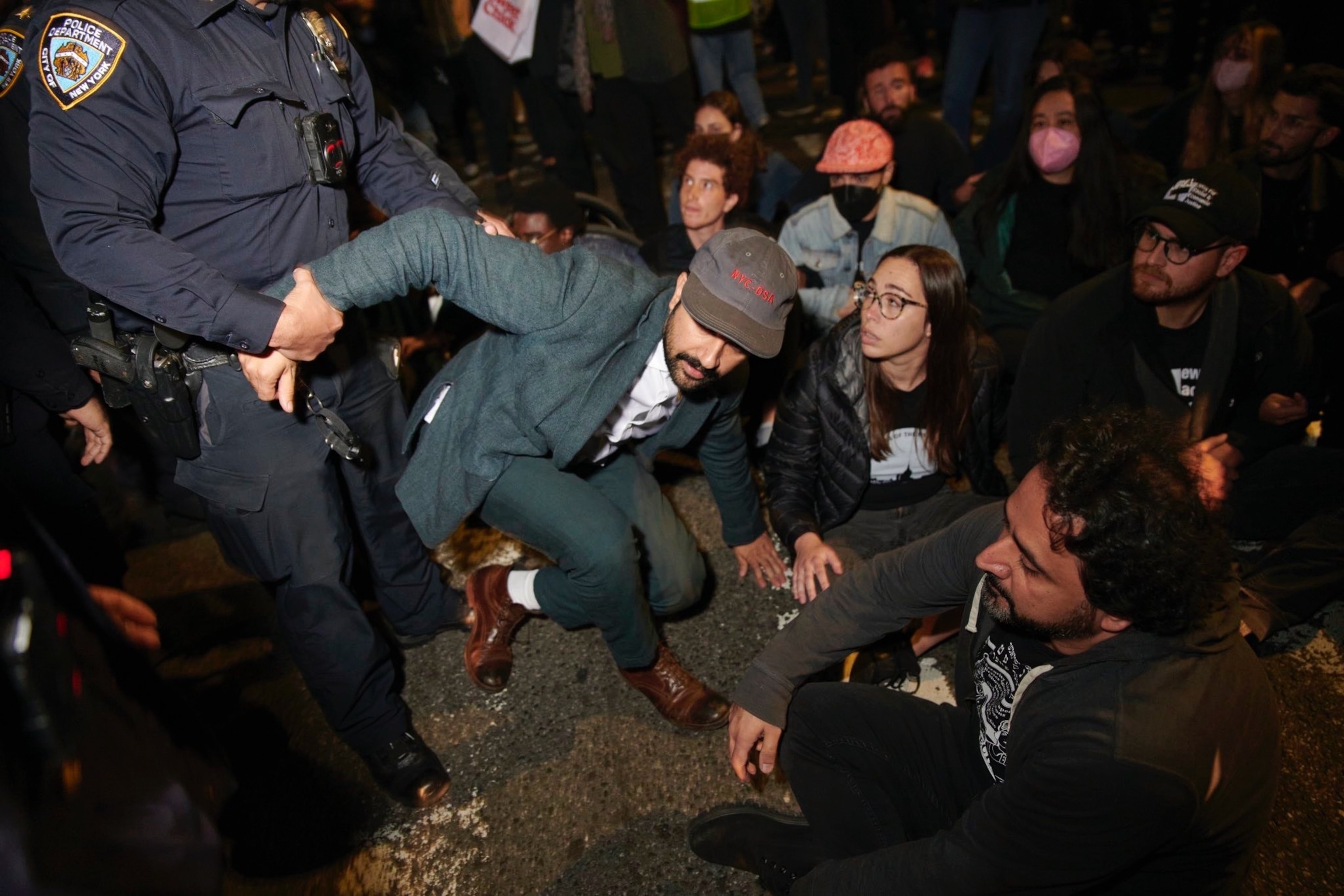 PHOTO: New York State Assemblymember Zohran Mamdani is arrested by an NYPD officer during civil disobedience outside the home of Senator Chuck Schumer, in Brooklyn, New York, Oct. 13, 2023.