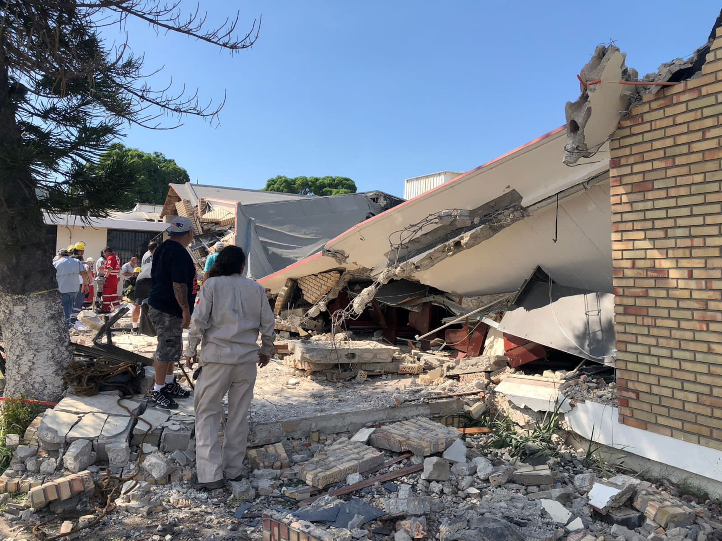 PHOTO: Members of a rescue team and people work at a site where a church roof collapsed during Sunday mass in Ciudad Madero, in Tamaulipas state, Mexico in this handout picture distributed to Reuters on Oct. 1, 2023.