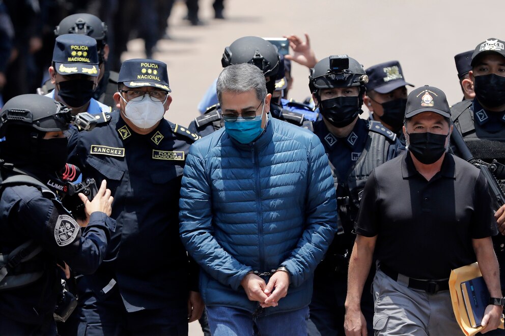 PHOTO: Former President of Honduras Juan Orlando Hernandez is escorted, April 21, 2022, by members of the Police Special Forces in Tegucigalpa, Honduras, to be extradited to United States after being indicted on drug traffickers charges.