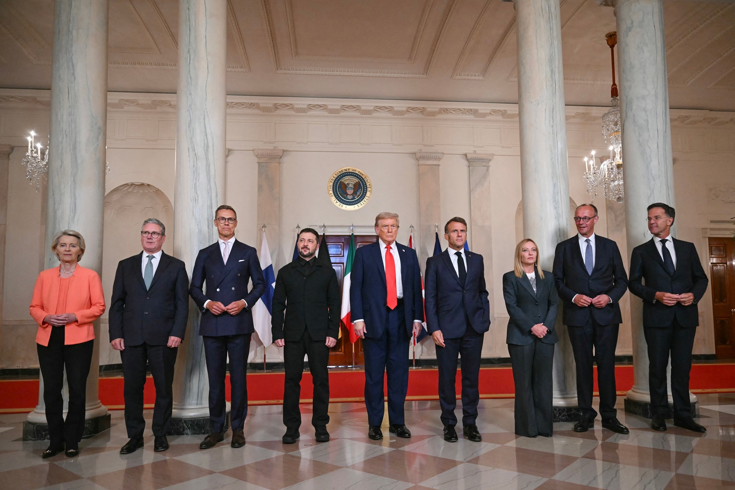 PHOTO: European leaders pose with Ukrainian President Volodymyr Zelensky and President Donald Trump  in the Cross Hall of the White House in Washington, August 18, 2025.