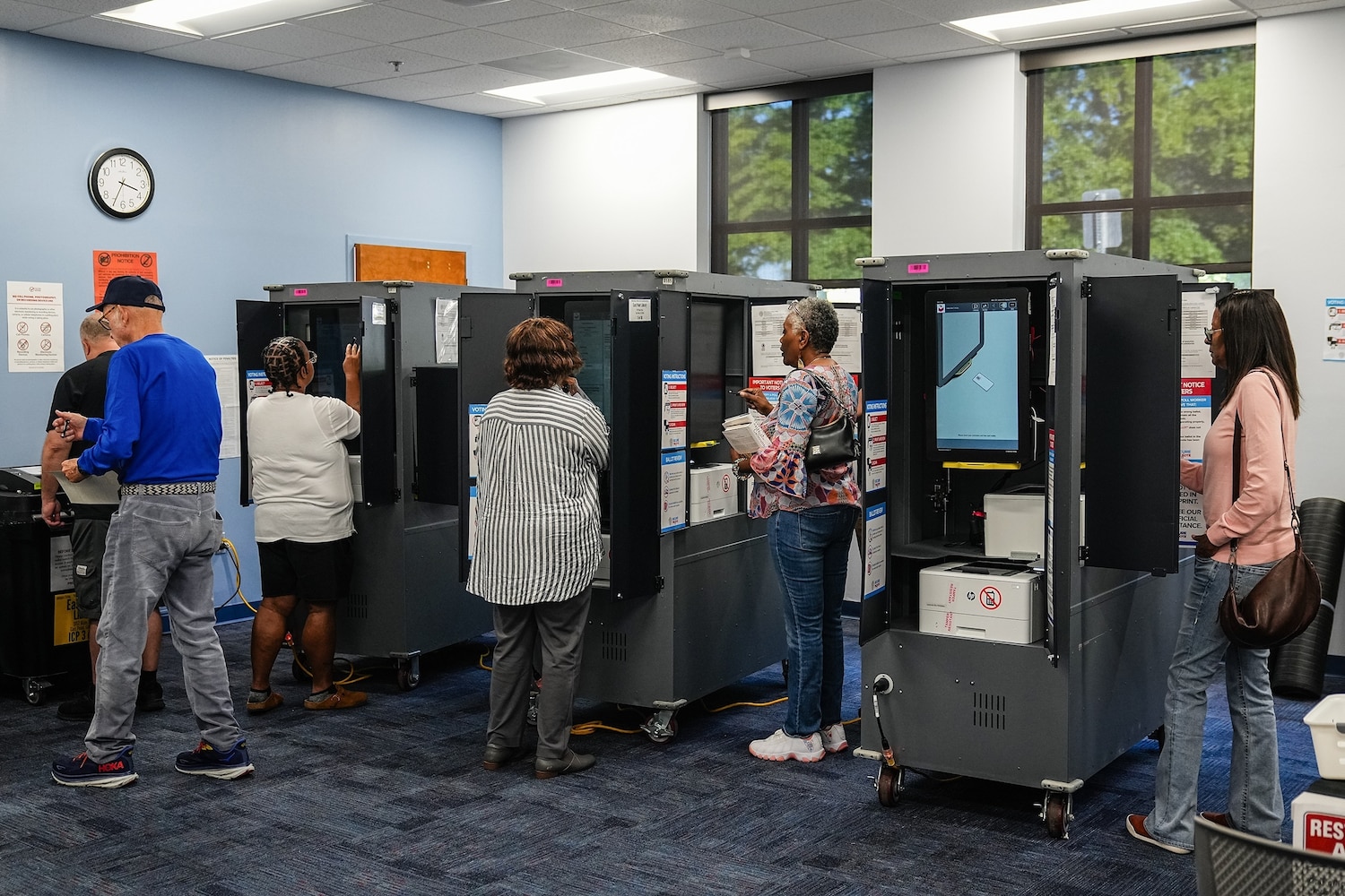 Voters cast their ballots at a polling location on the first day of early voting for the midterm election in East Point, Georgia, Oct. 13, 2026. Elijah Nouvelage/Bloomberg via Getty Images