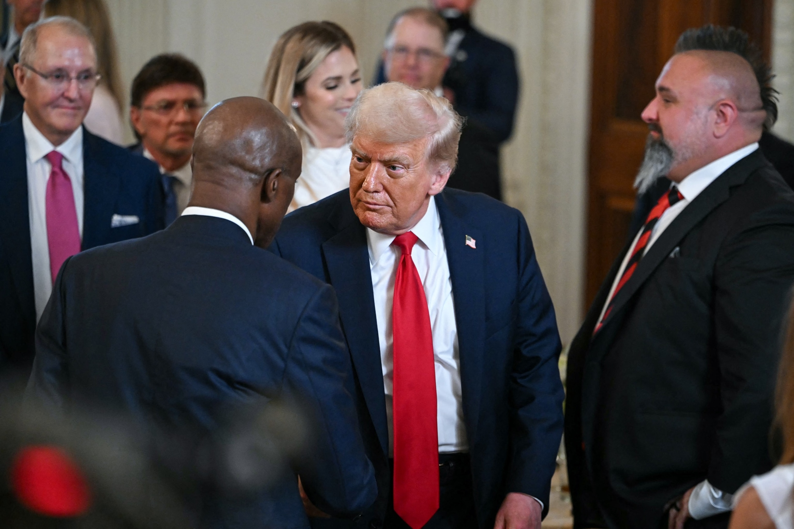 PHOTO: President Donald Trump departs after participating in a White House Faith Office luncheon in the State Dining Room of the White House,  July 14, 2025.