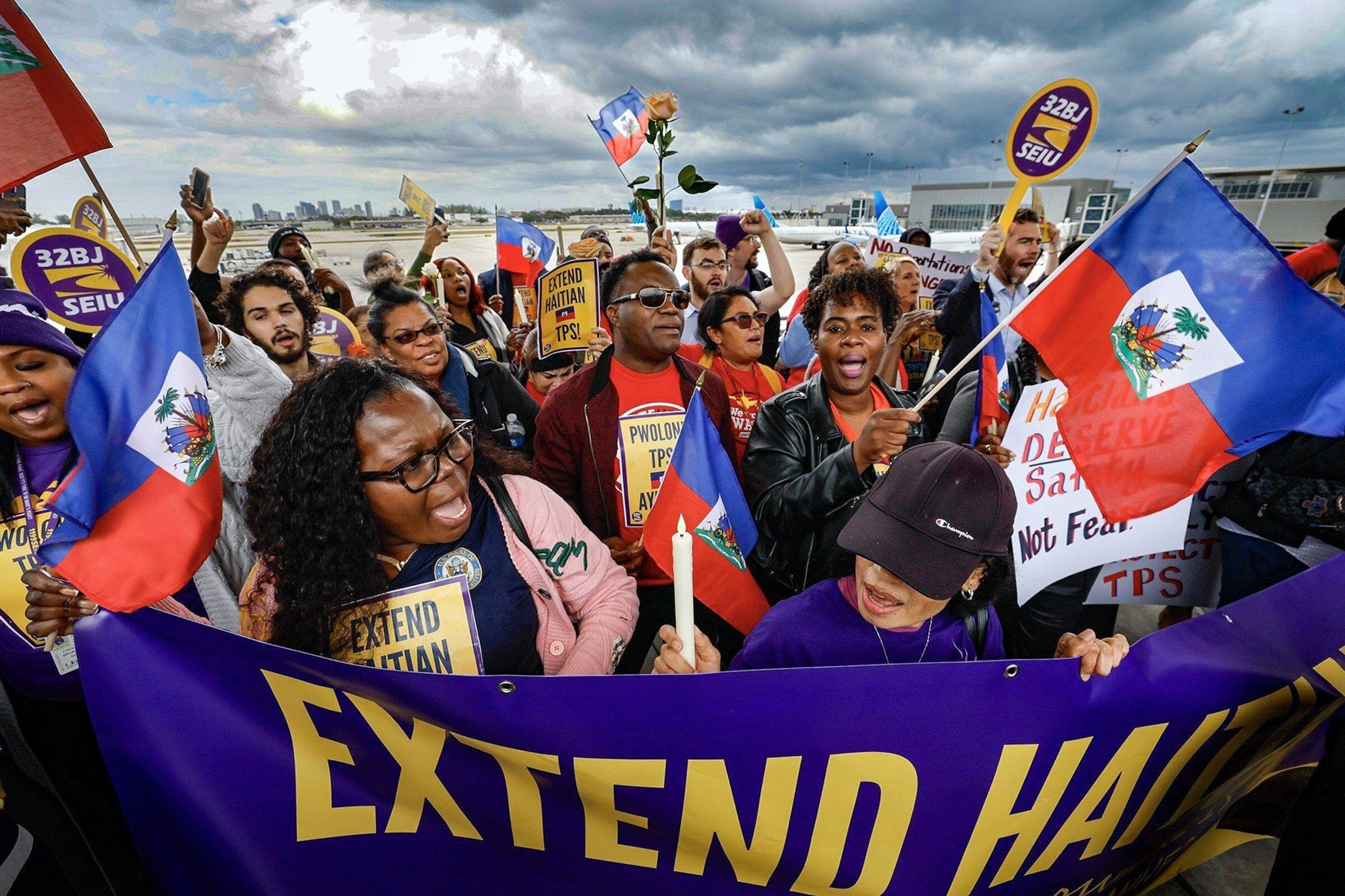 PHOTO: Protesters gather at Fort Lauderdale-Hollywood International Airport as airport workers and faith leaders rally calling on the federal government to extend Temporary Protected Status for Haiti, Jan. 28, 2026.