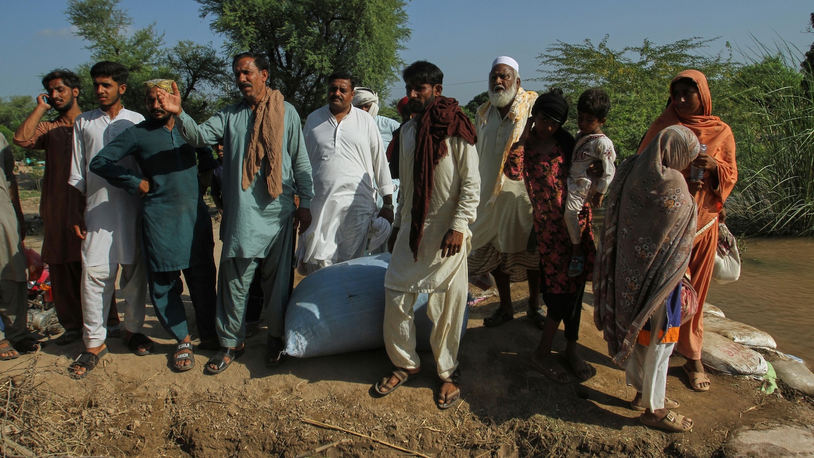Flood survivors begin to return home in Pakistan's eastern Punjab as water recedes