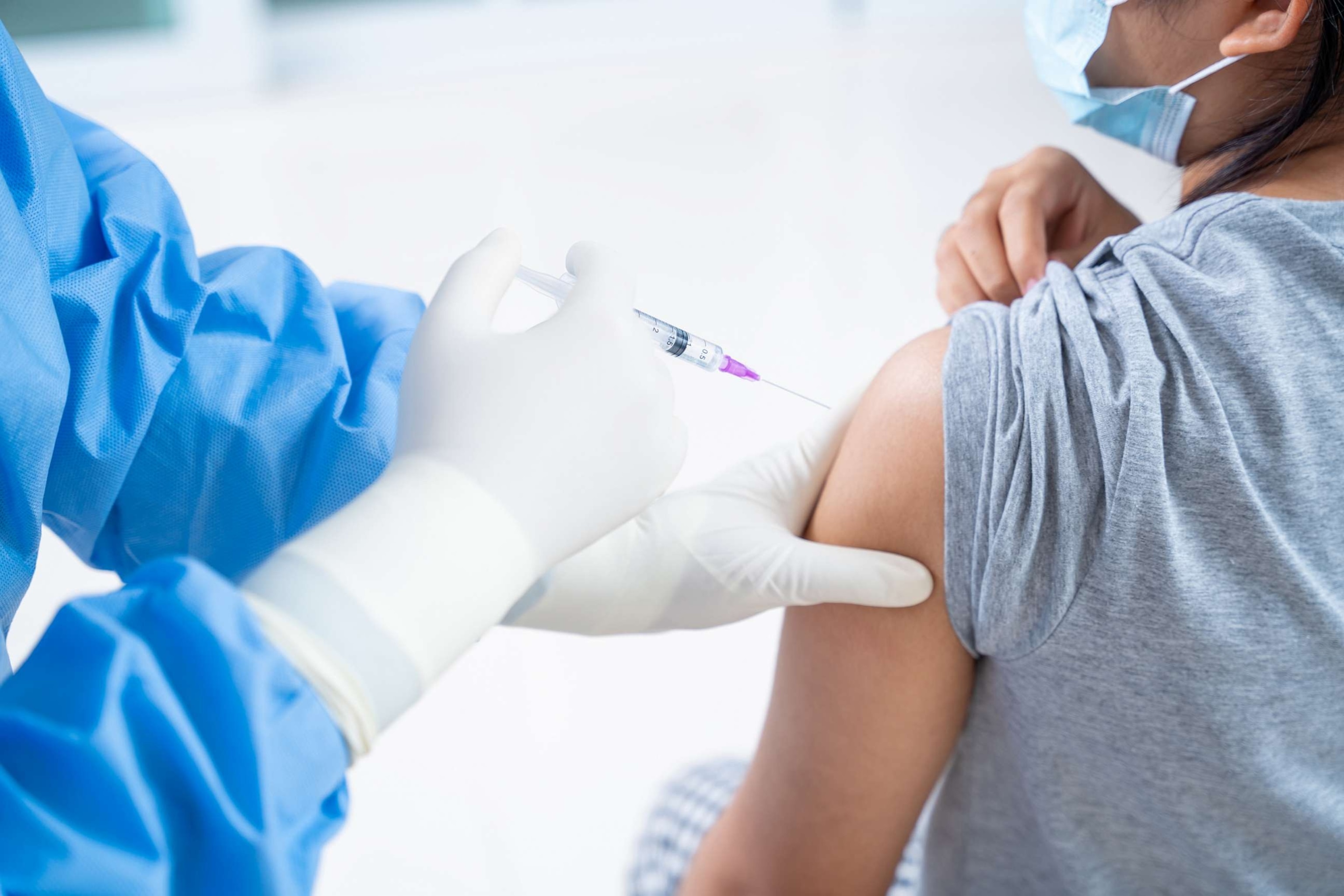 PHOTO: In this undated stock photo, a young patient receives a vaccine injection from a doctor.