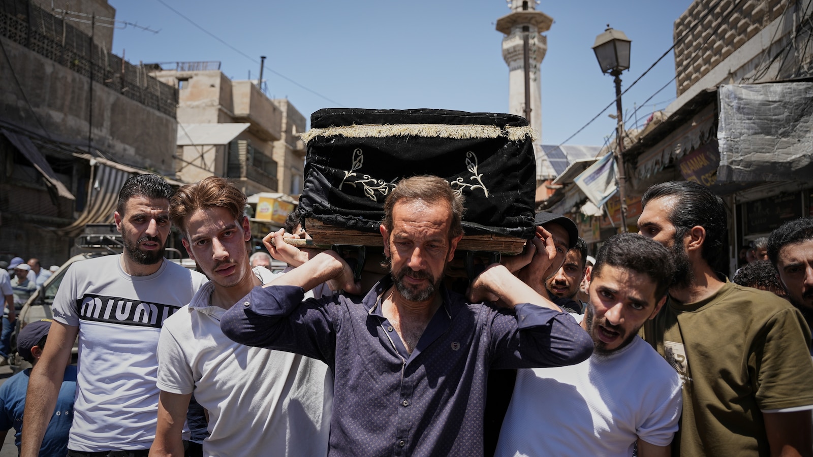 Mourners in Damascus bury cafe blast victims as officials promise justice