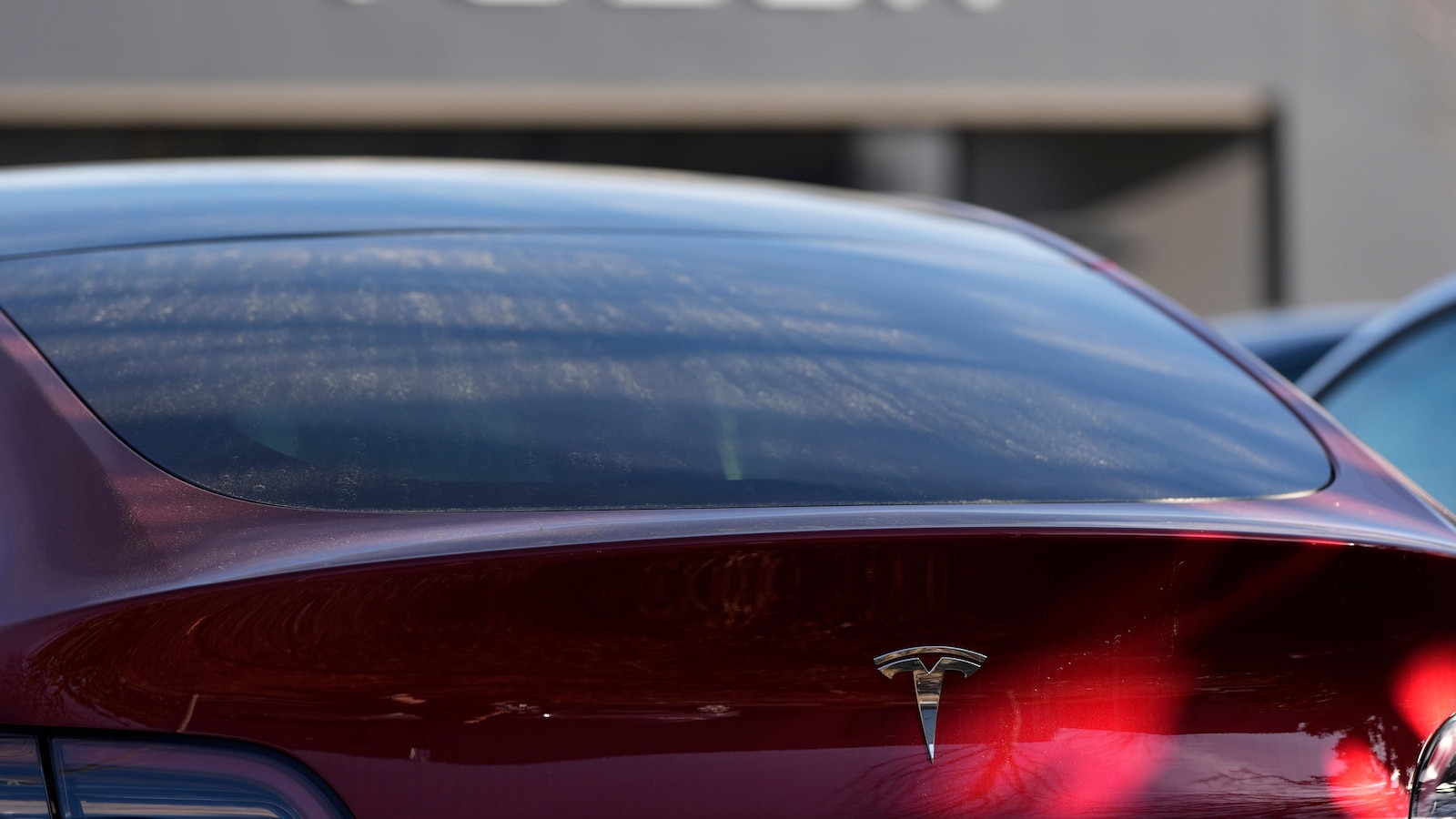 Tesla under investigation after parents say faulty door handles trapped their kids in the back