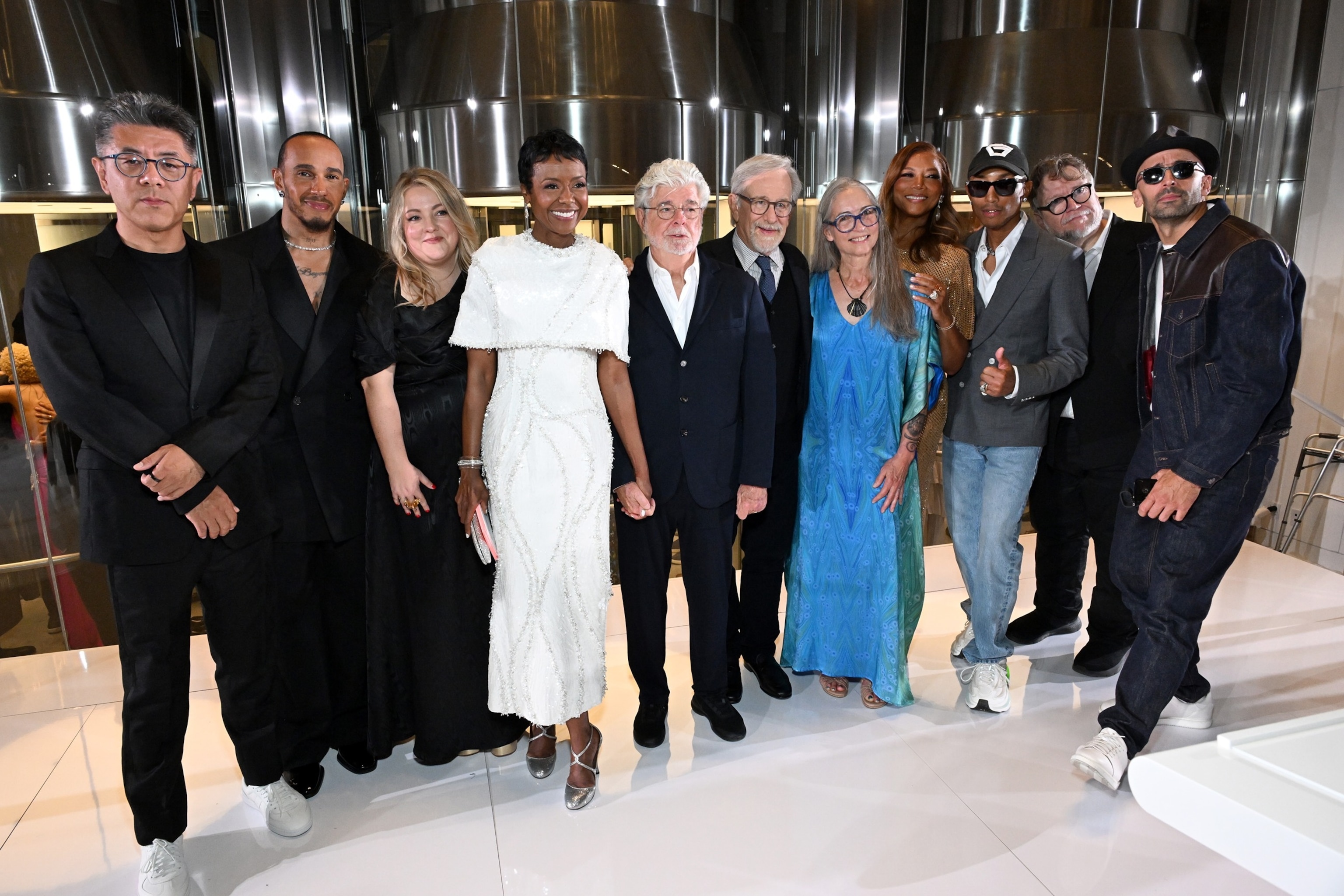 PHOTO: Ma Yansong, Lewis Hamilton, Tracey Bates, Mellody Hobson, George Lucas, Steven Spielberg, Julie Bell, Queen Latifah, Pharrell Williams, Guillermo del Toro and JR attend the Lucas Museum of Narrative Art Opening Night on September 19.