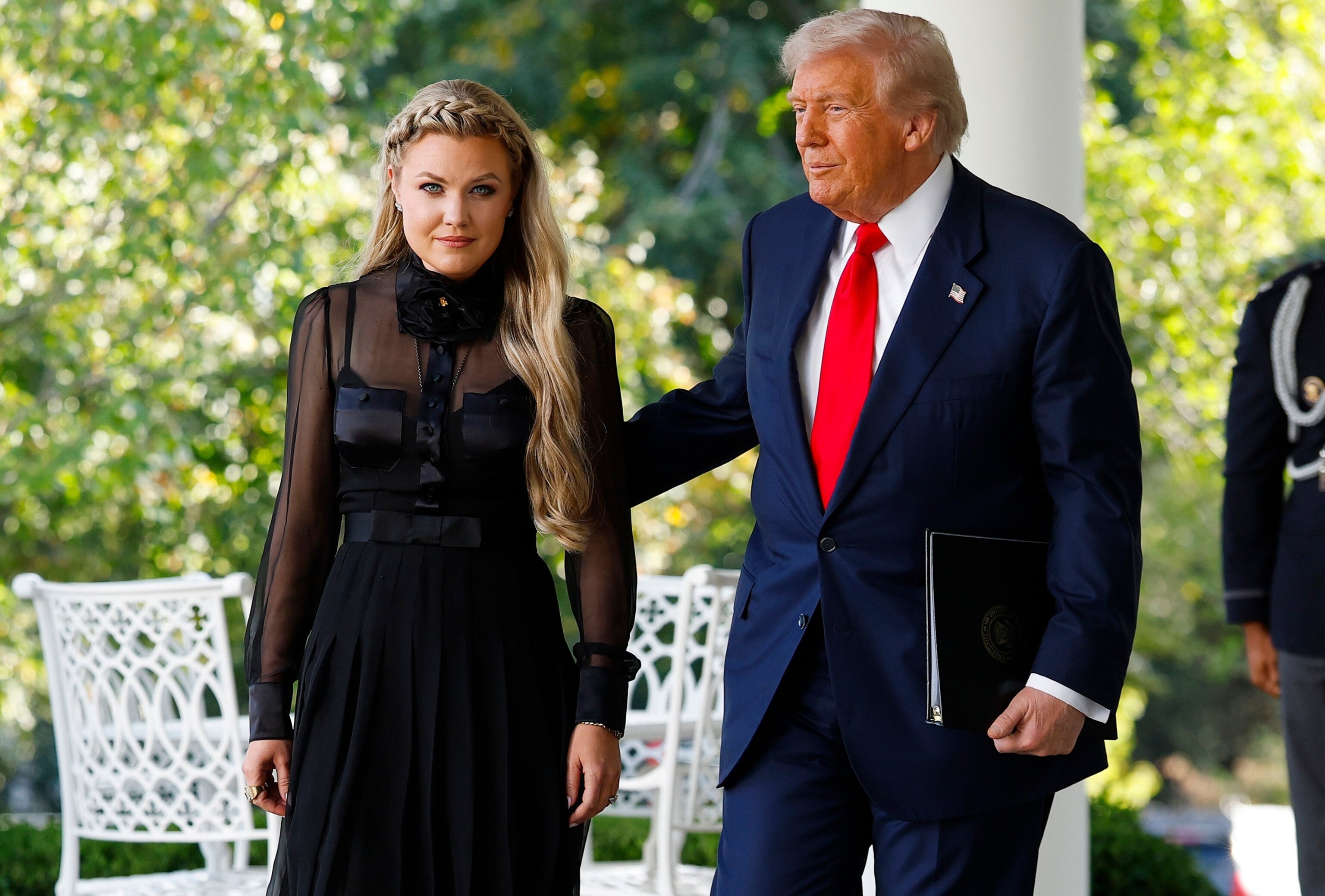 PHOTO: Erika Kirk wife of late conservative activist Charlie Kirk, arrives with President Donald Trump as he posthumously awards the Presidential Medal of Freedom to Charlie Kirk in the Rose Garden of the White House, OCt. 14, 2025 in Washington.