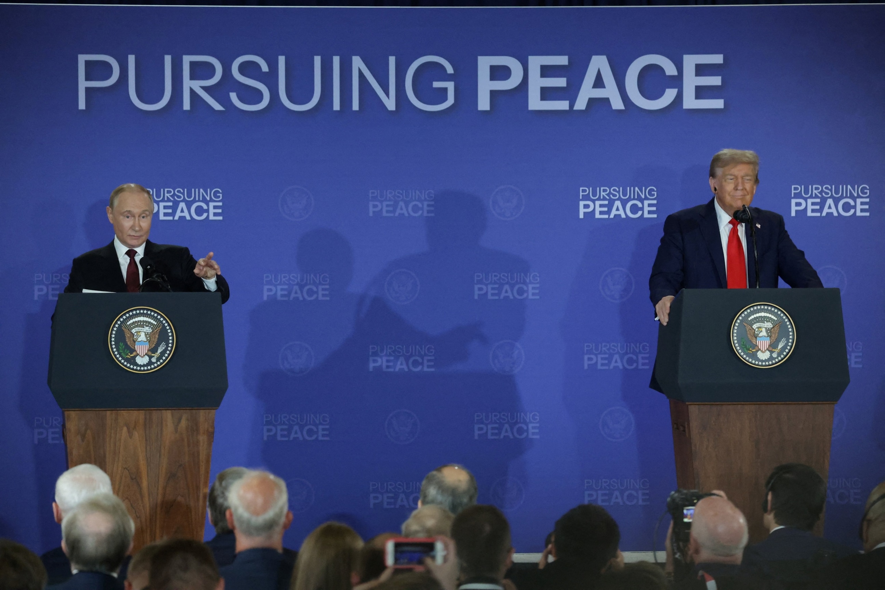 PHOTO: President Donald Trump and  Russian President Vladimir Putin hold a press conference following their meeting to negotiate an end to the war in Ukraine, at Joint Base Elmendorf-Richardson in Anchorage, Alaska, August 15, 2025.