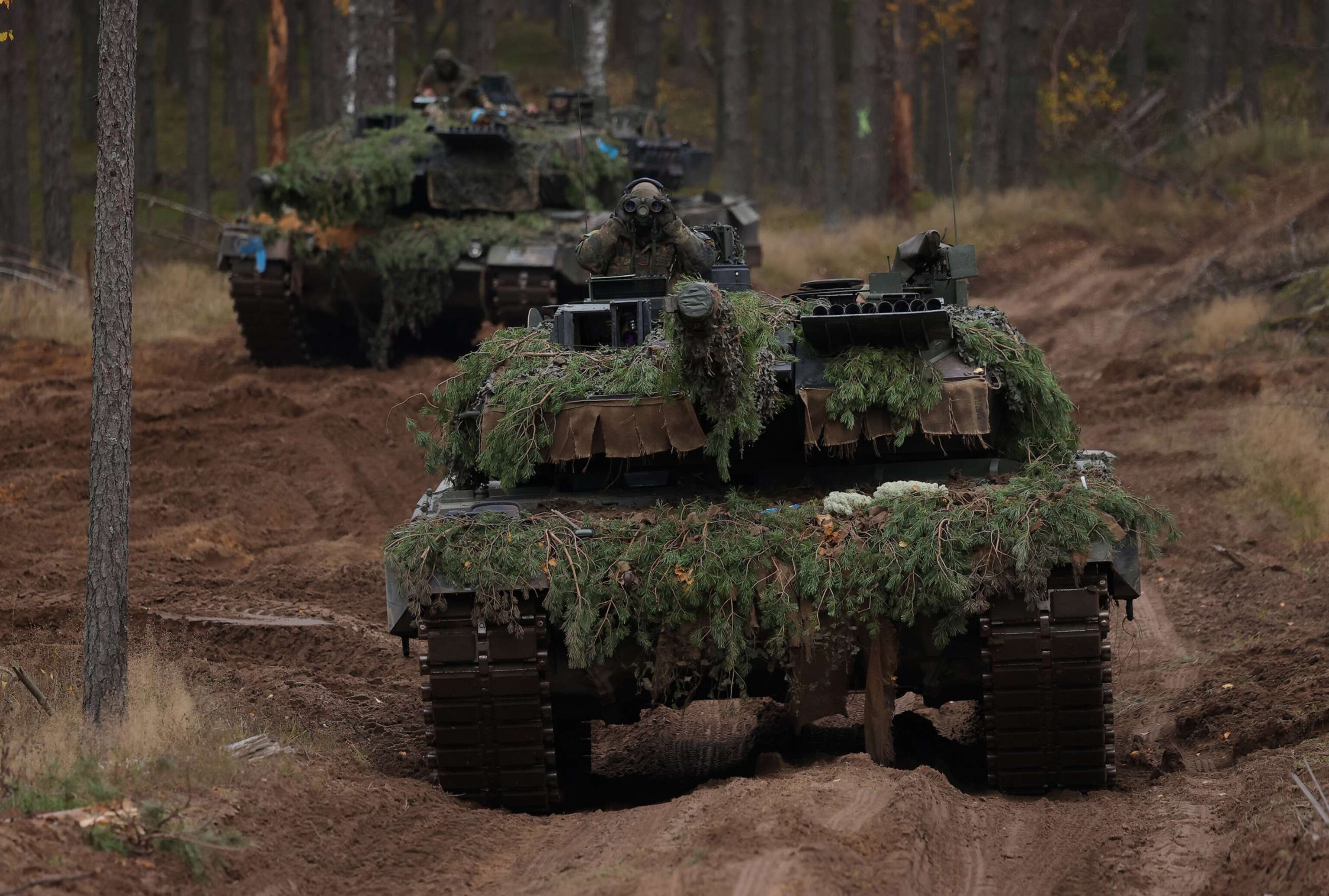 PHOTO: Two Leopard 2A6 main battle tanks participate in the NATO Iron Wolf military exercises, Oct. 27, 2022, in Pabrade, Lithuania.