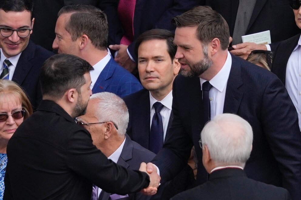 PHOTO: Ukraine's President Volodymr Zelenskyy, left, and Vice President JD Vance greet each other as Secretary of State Marco Rubio, center, looksin St. Peter's Square attended by heads of state, royalty and ordinary faithful, Sunday, May 18, 2025.