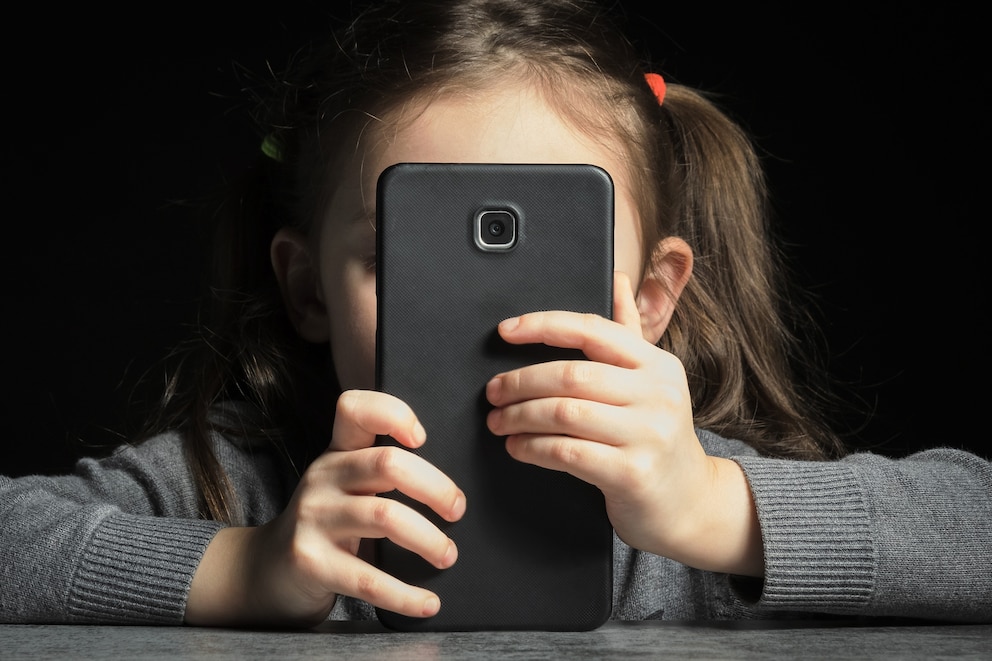 PHOTO: A child looks a phone screen in this undated stock photo.