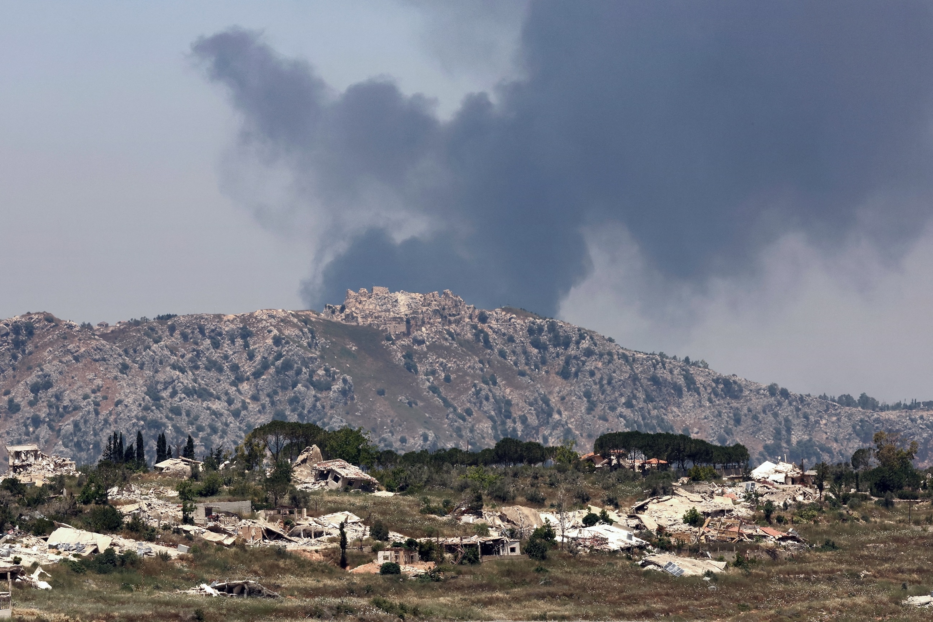 PHOTO: This picture taken from a position in the Upper Galilee in northern Israel, near the Israel-Lebanon border on June 17, 2026, shows smoke billowing in the distance behind the medieval Beaufort Castle in southern Lebanon.