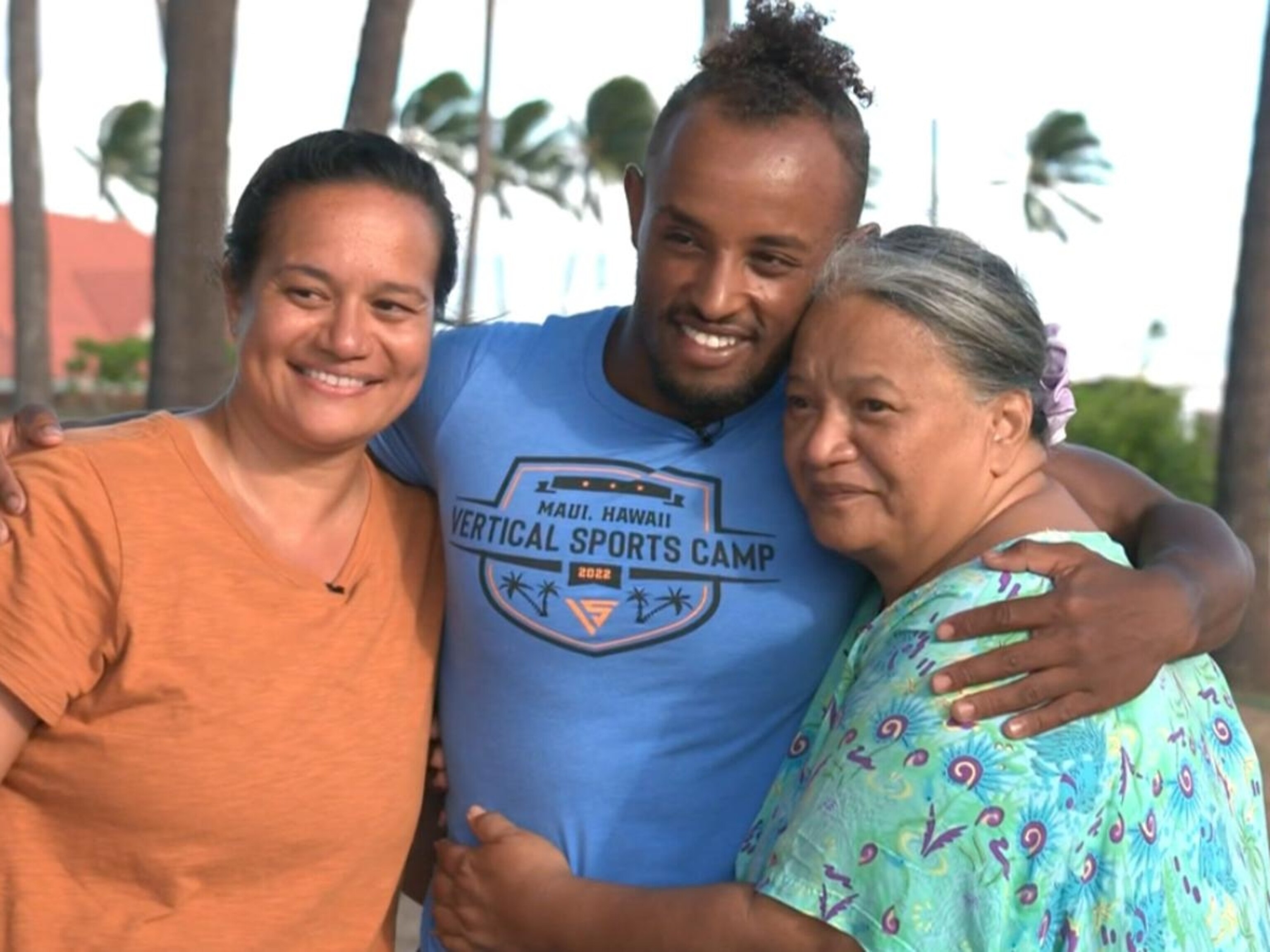 Woman reunites with stranger who carried her on his back to