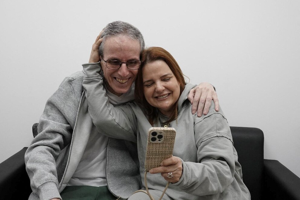 PHOTO: Released hostage, Ohad Ben Ami, embraces a loved one as he is reunited with his family at Sheba Medical Center in Ramat Gan, Israel, in this handout image obtained by Reuters on February 8, 2025.