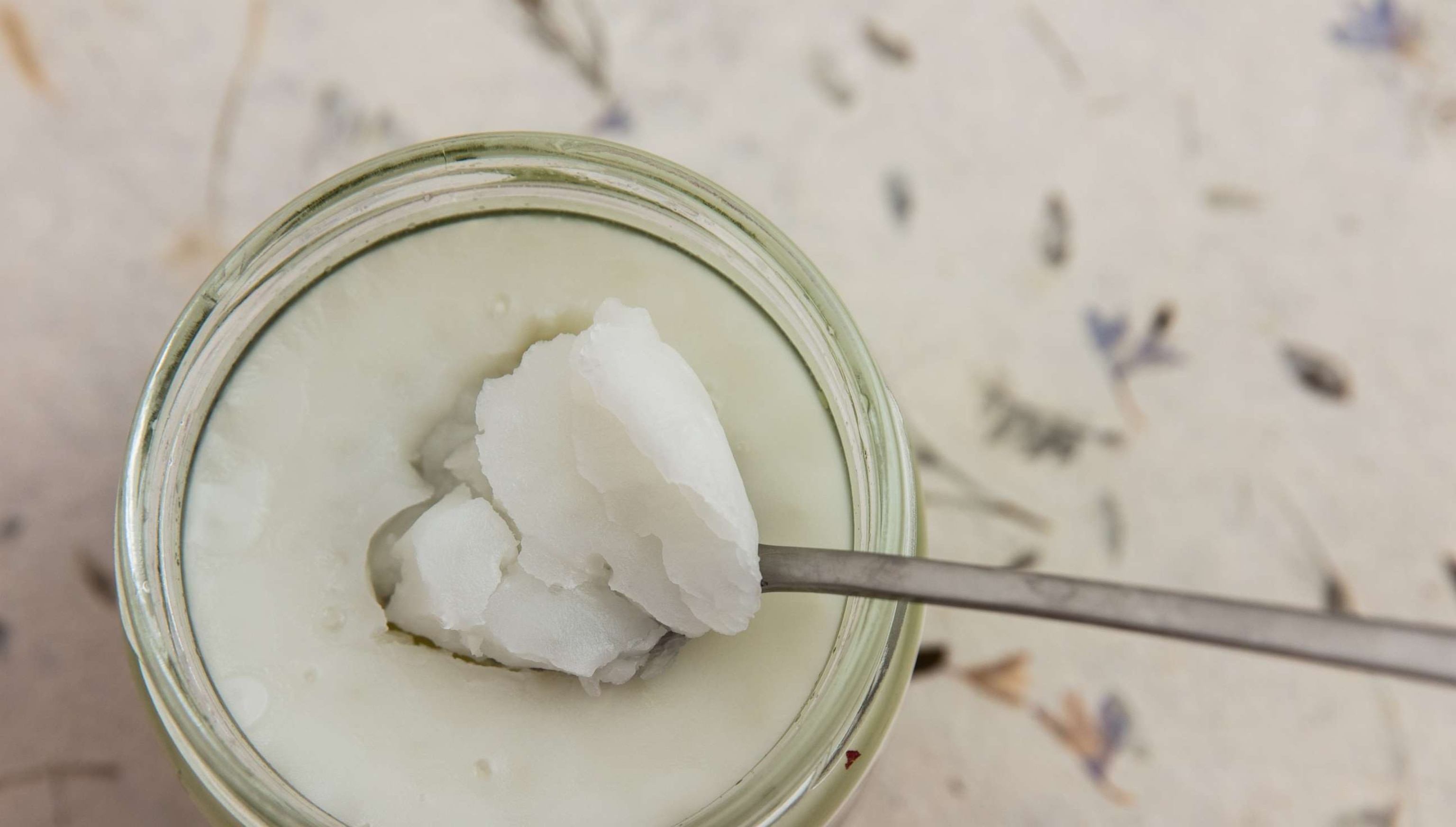 PHOTO: Coconut oil in a glass jar.