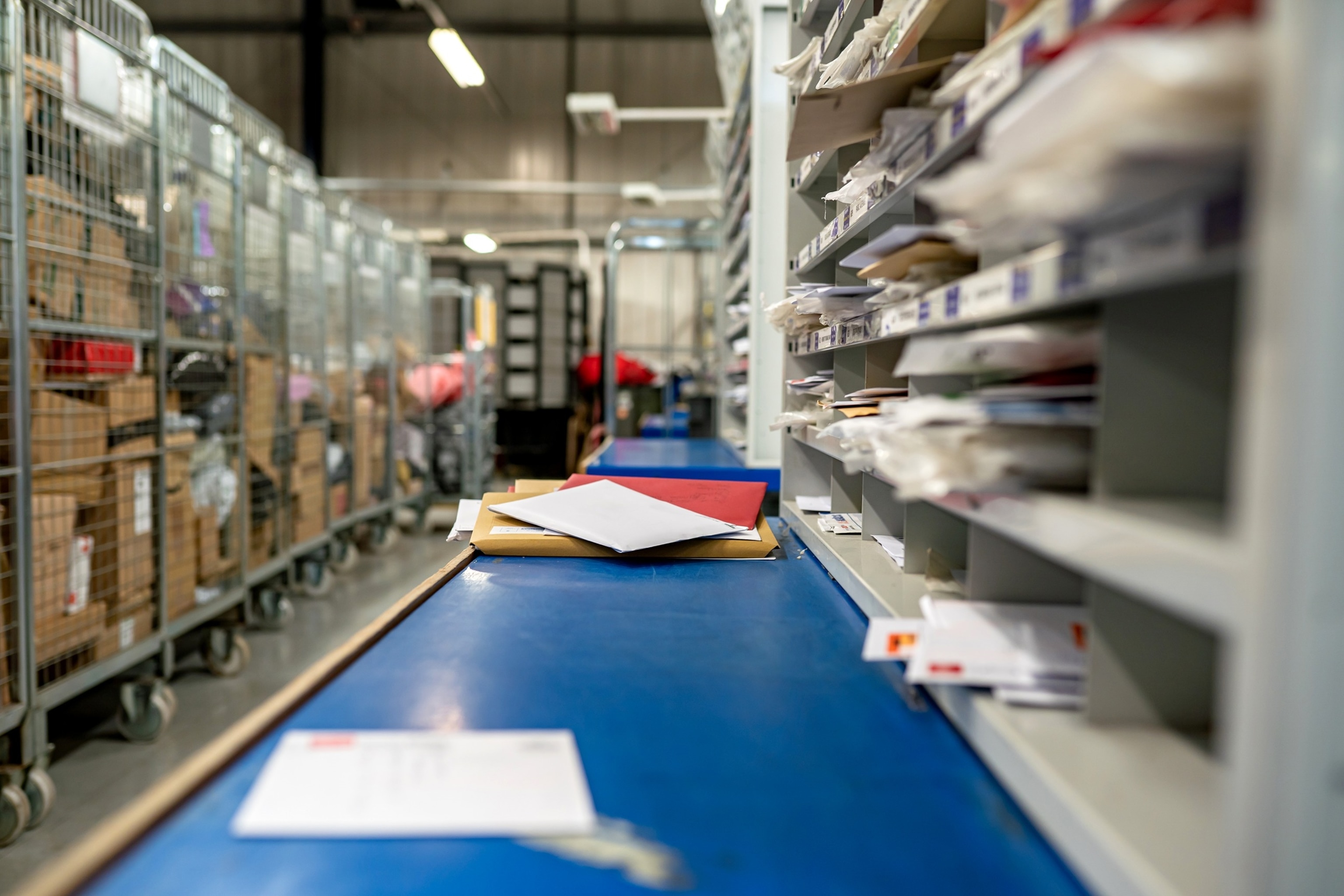 PHOTO: Letters on a table in a mail centre sorting office