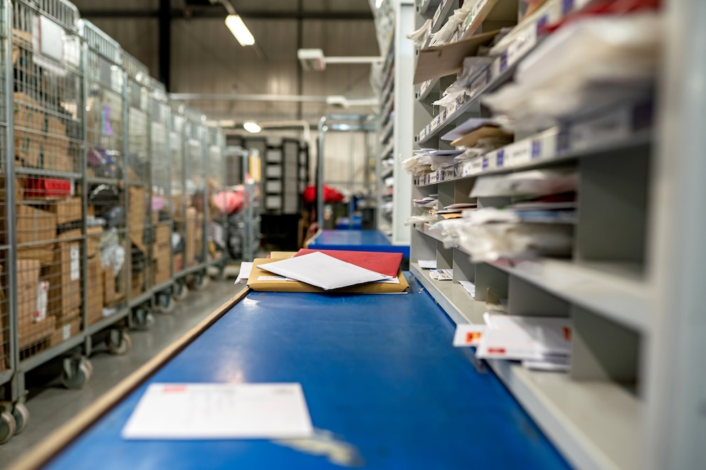 PHOTO: Letters on a table in a mail centre sorting office