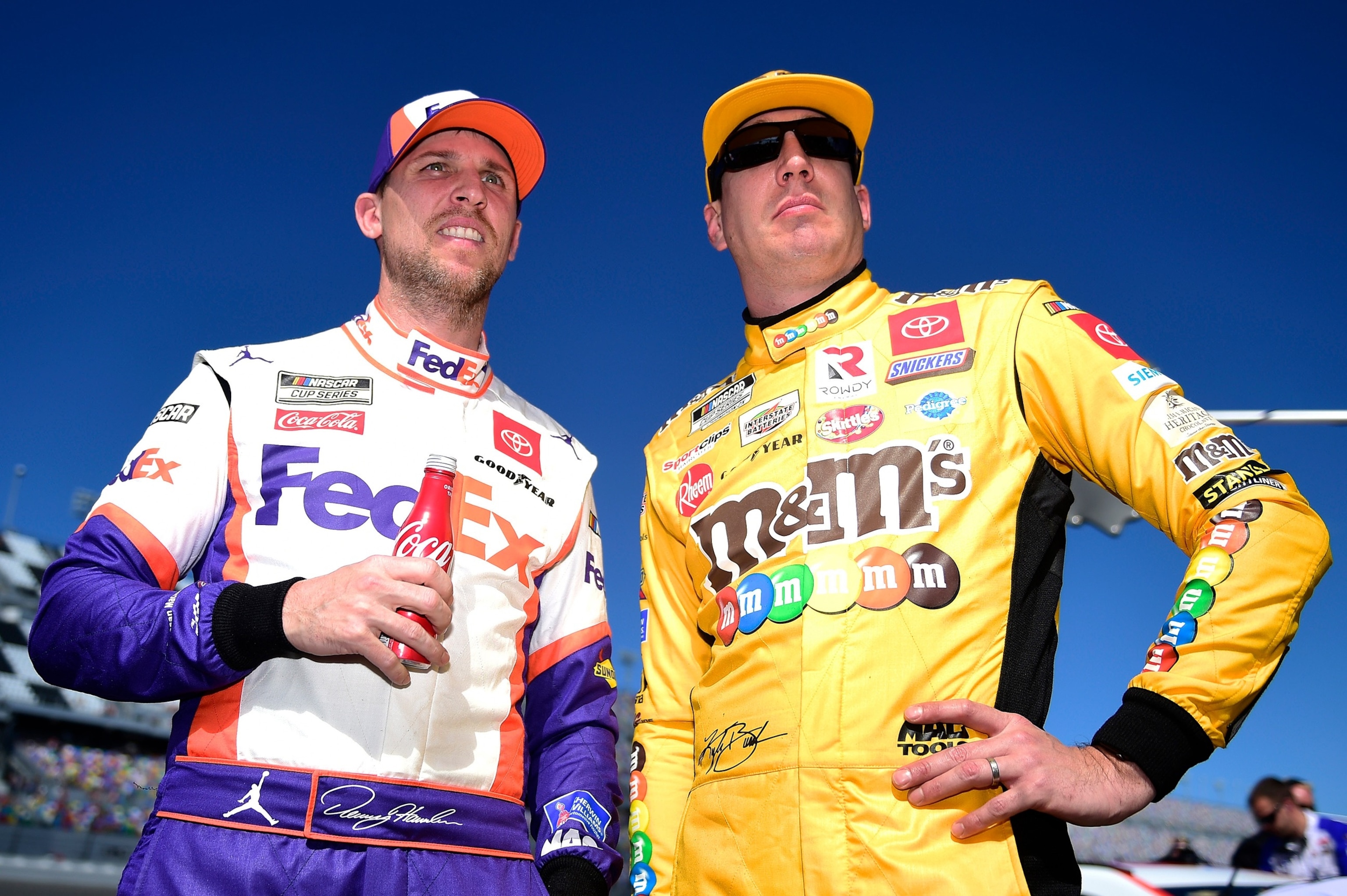 PHOTO: Kyle Busch and Denny Hamlin stand on the grid during qualifying for the NASCAR Cup Series 62nd Annual Daytona 500 at Daytona International Speedway, on Feb. 9, 2020, in Daytona Beach, Fla.